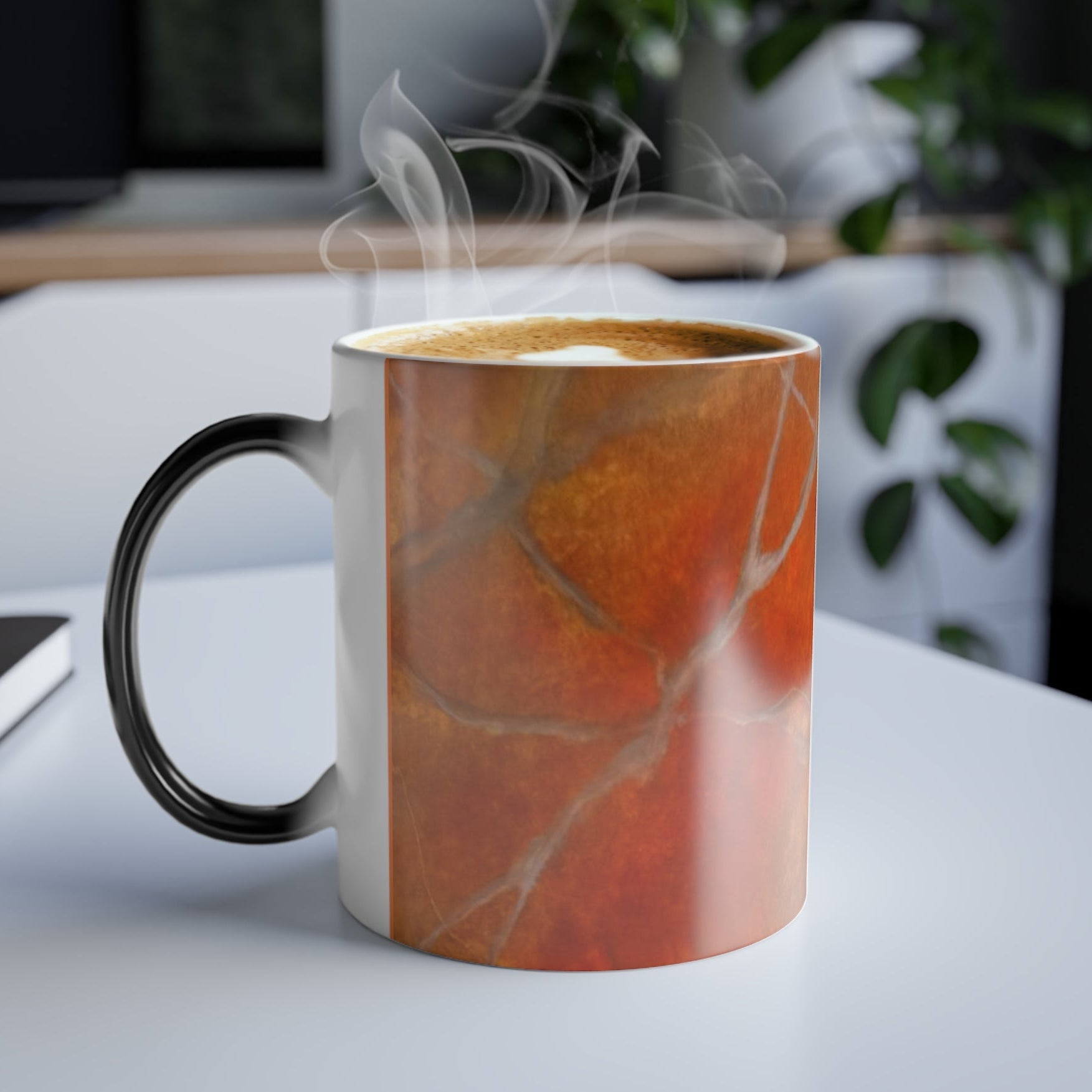 Marbled mug in vivid red/orange with black 'C' handle for comfort