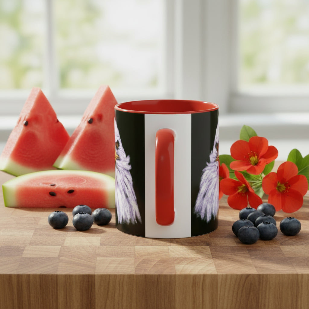 Mug with a red interior and handle, black exterior with a white stripe and red handle and bald eagle on either side