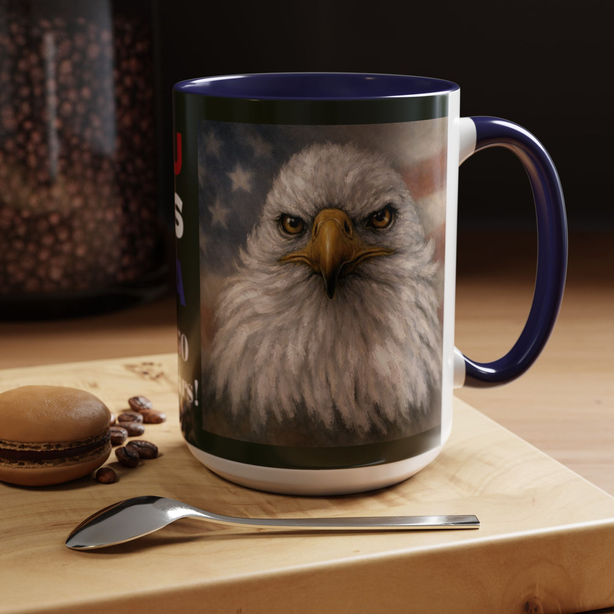 A ceramic coffee mug with a navy blue handle and interior, featuring a detailed graphic print of a bald eagle's face. 15oz