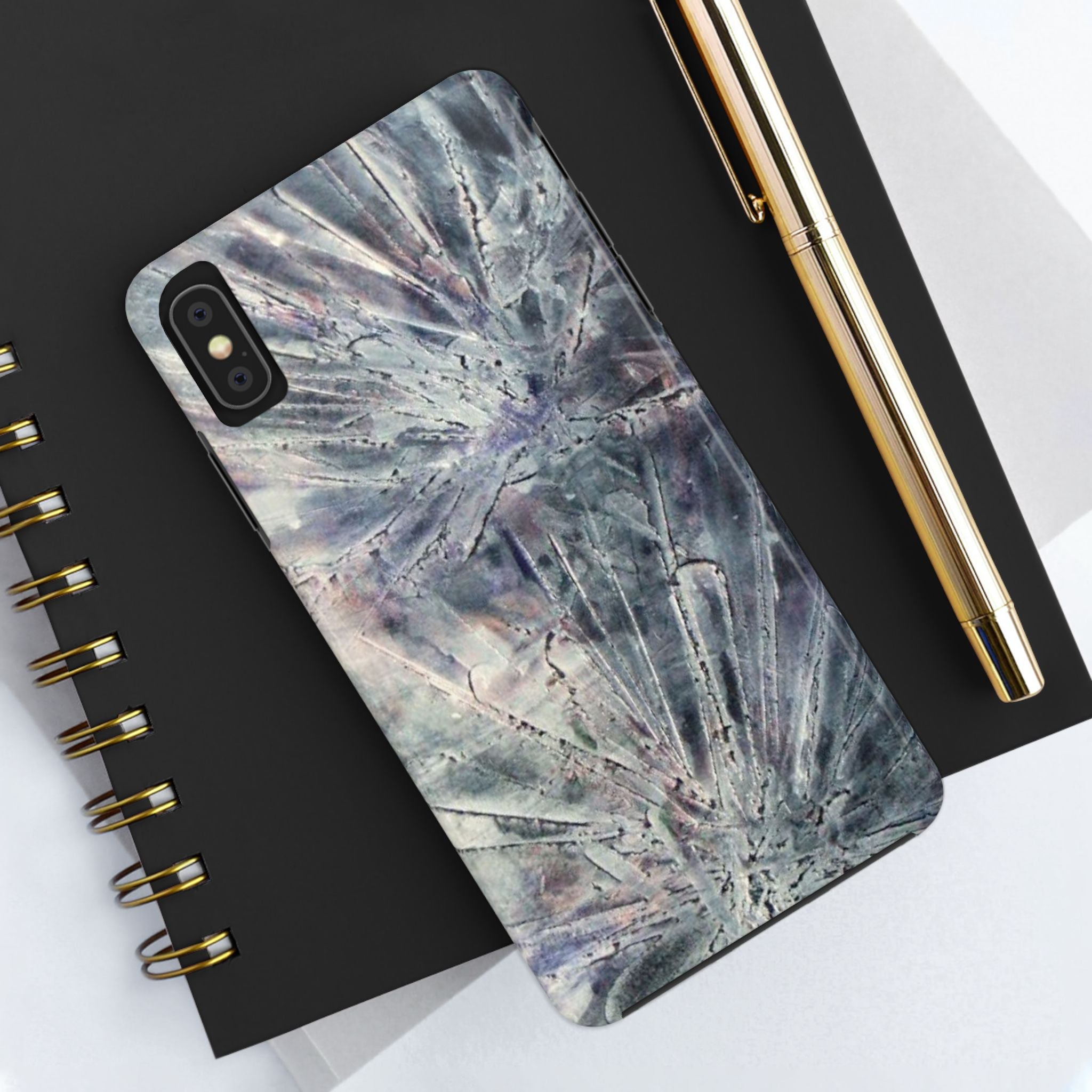 Phone case in abstract bursts of silver crystal design with rubber lining for strong impact and UV protection