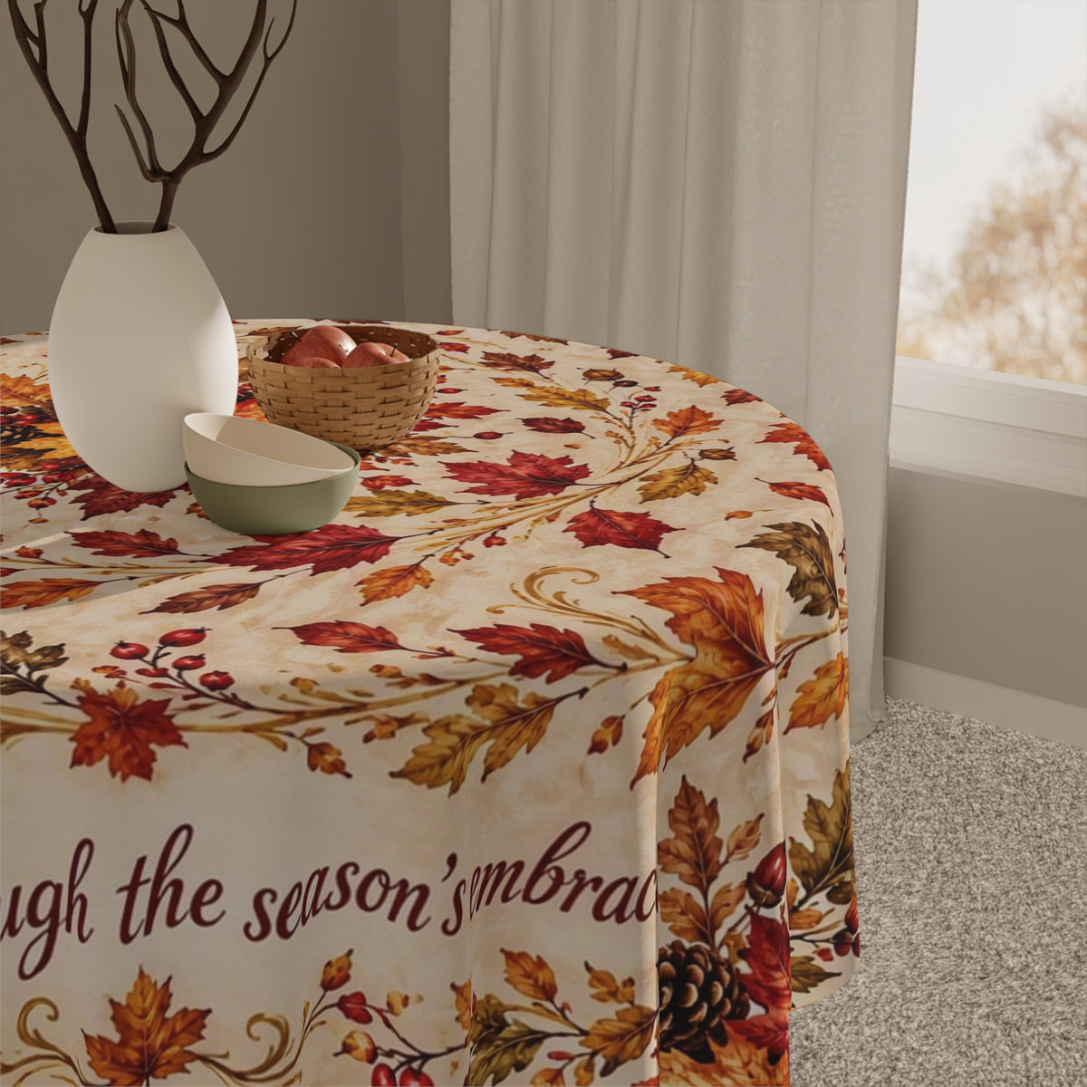 A round table covered with a cream tablecloth featuring an autumn leaf and berry pattern in polyester - machine washable 55 x 55