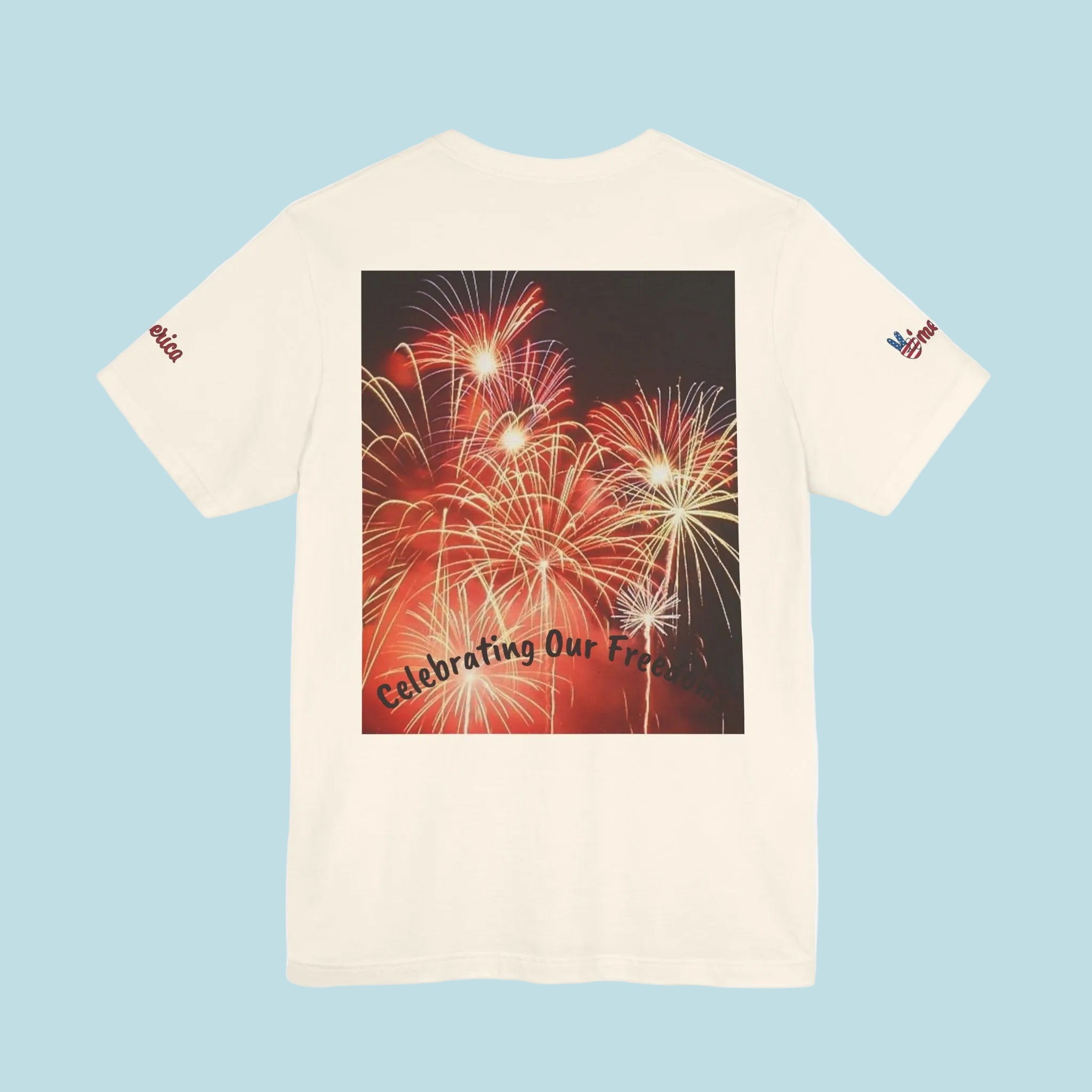 White t-shirt with a graphic of fireworks and text on the back