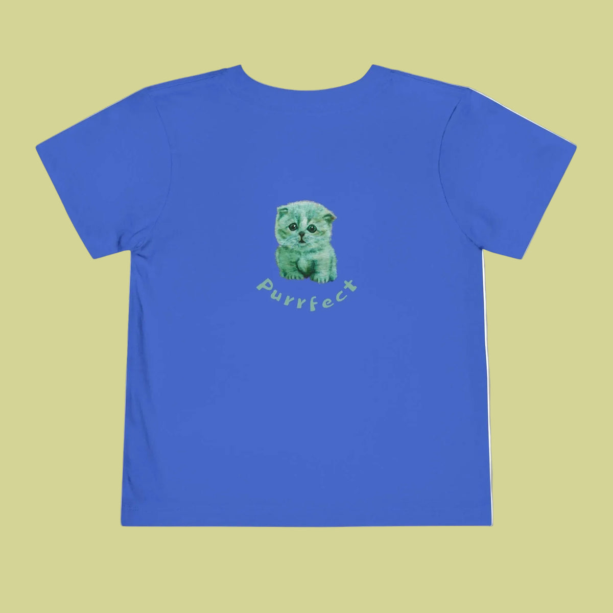 Back of a royal blue short-sleeve t-shirt with a central graphic of a green kitten sitting above the word 'Purrfect' in a light green script