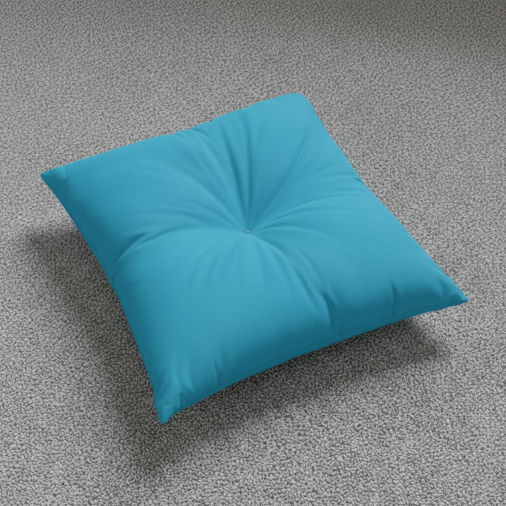 back of Teal floor pillow on a grey carpet