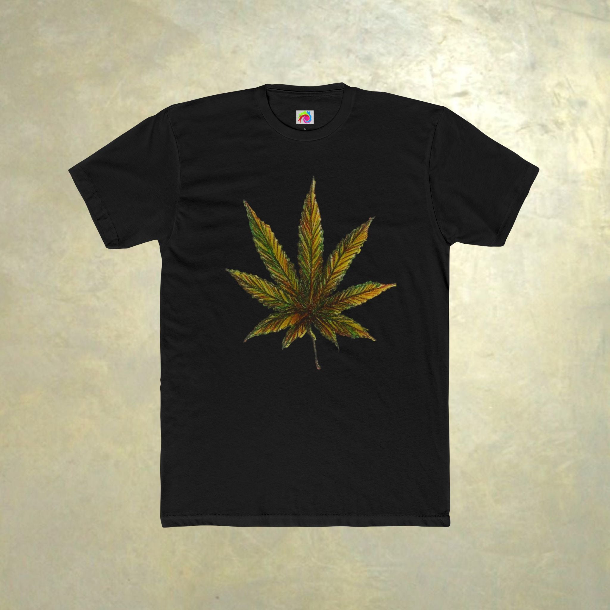 Black t-shirt with a cannabis leaf design on a textured beige background