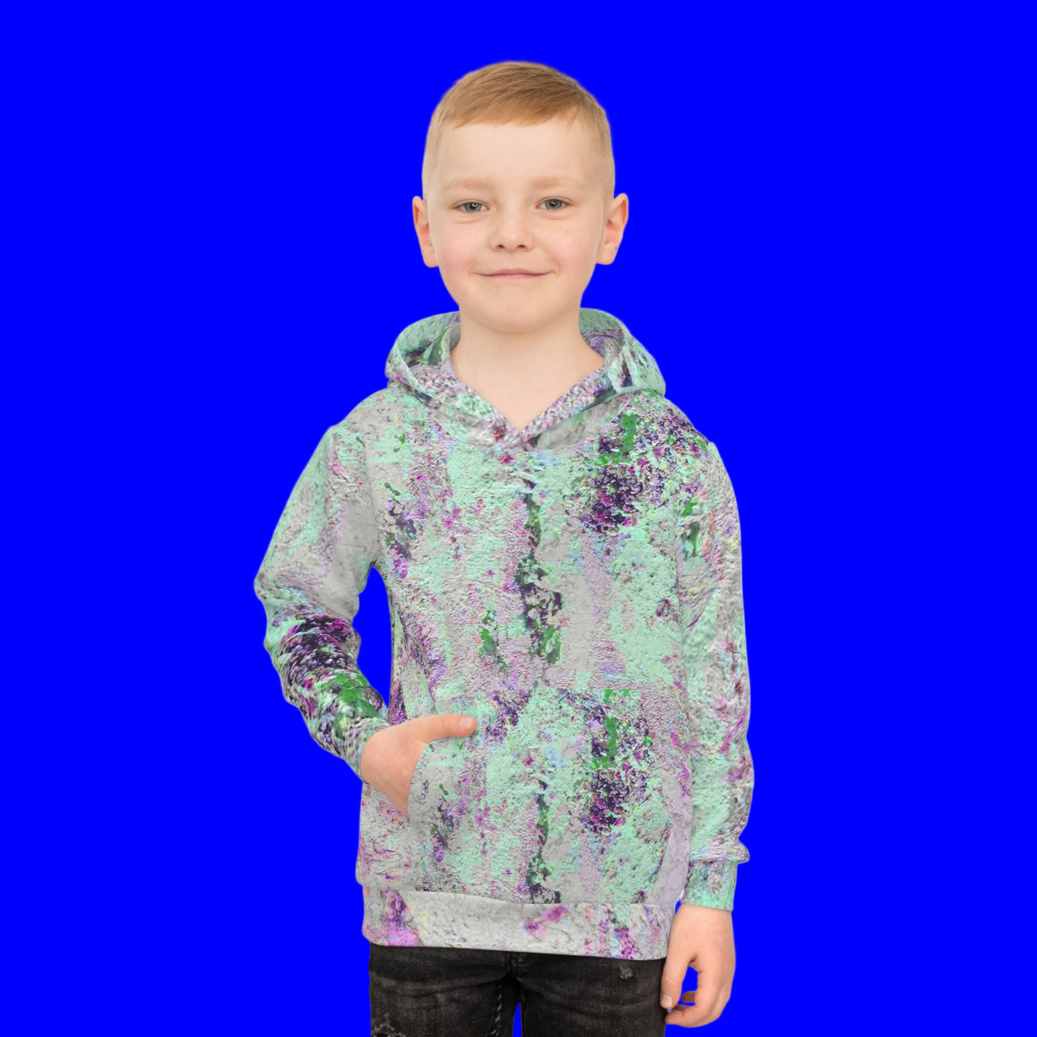 Boy wearing unisex hoodie in unique abstract design