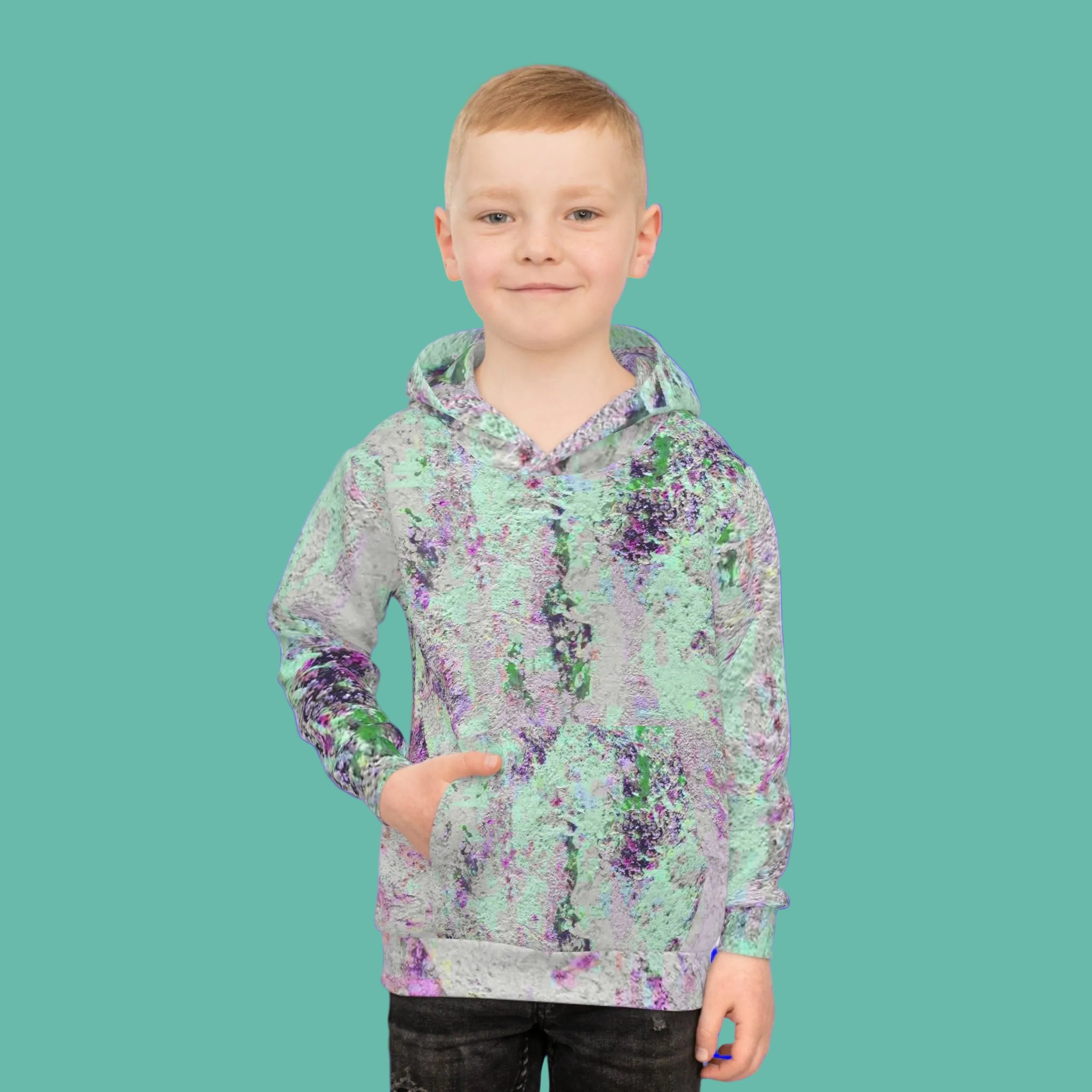 Boy wearing unisex hoodie in unique abstract design