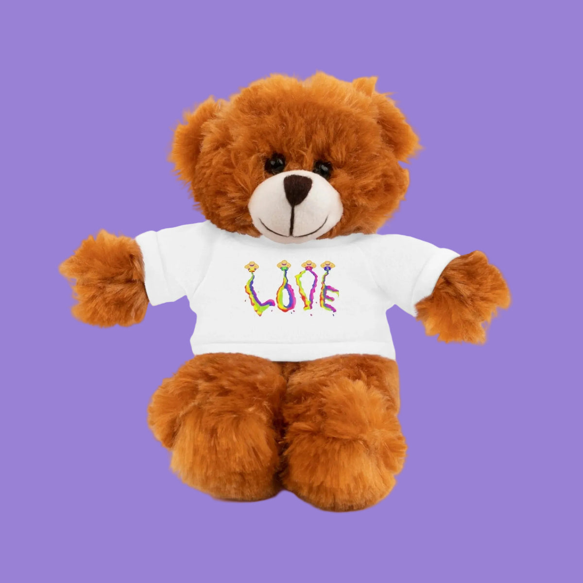 Brown teddy bear wearing a white shirt with a blue with LOVE message