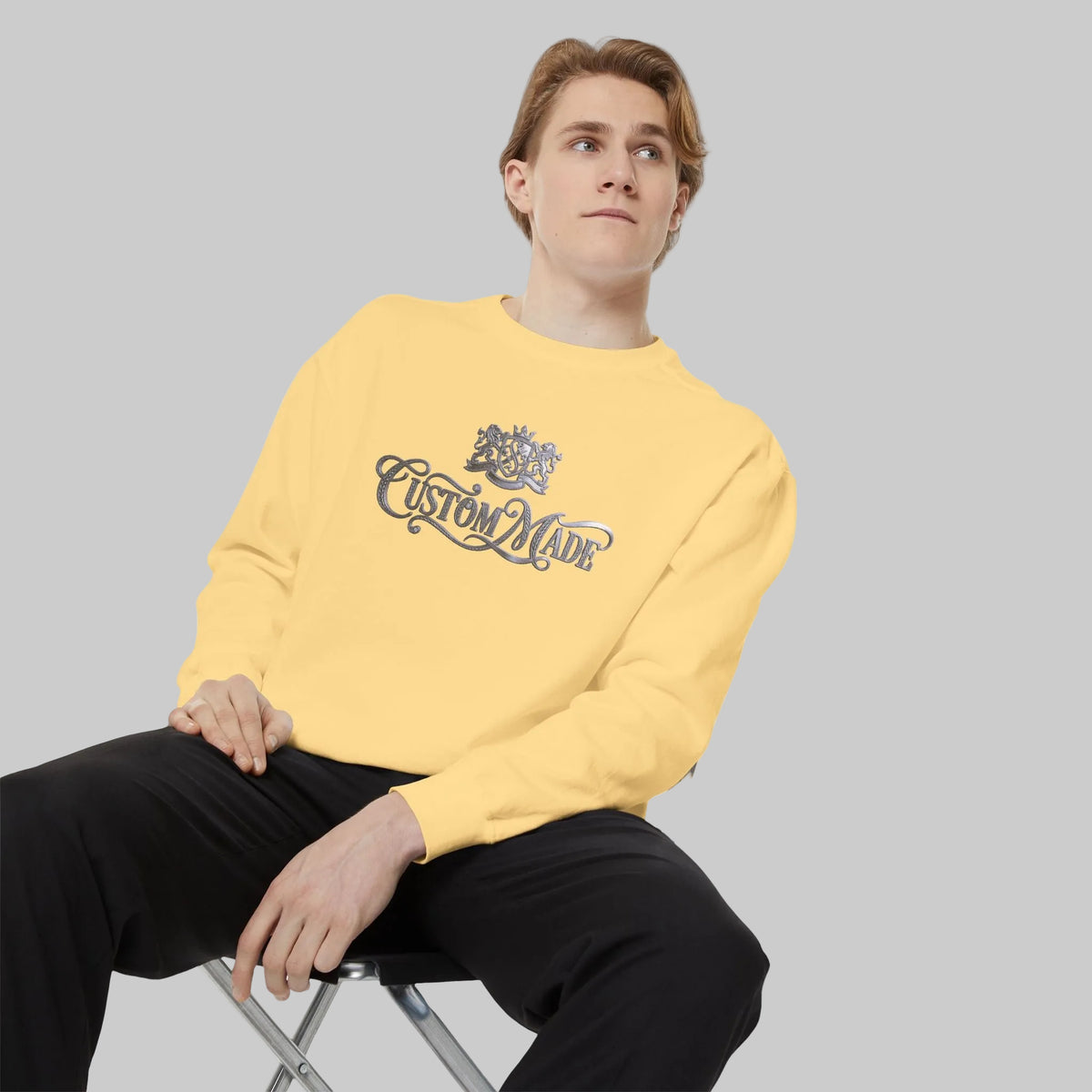 Butter yellow crewneck sweatshirt with a Silver graphic print that reads 'Custom Made'