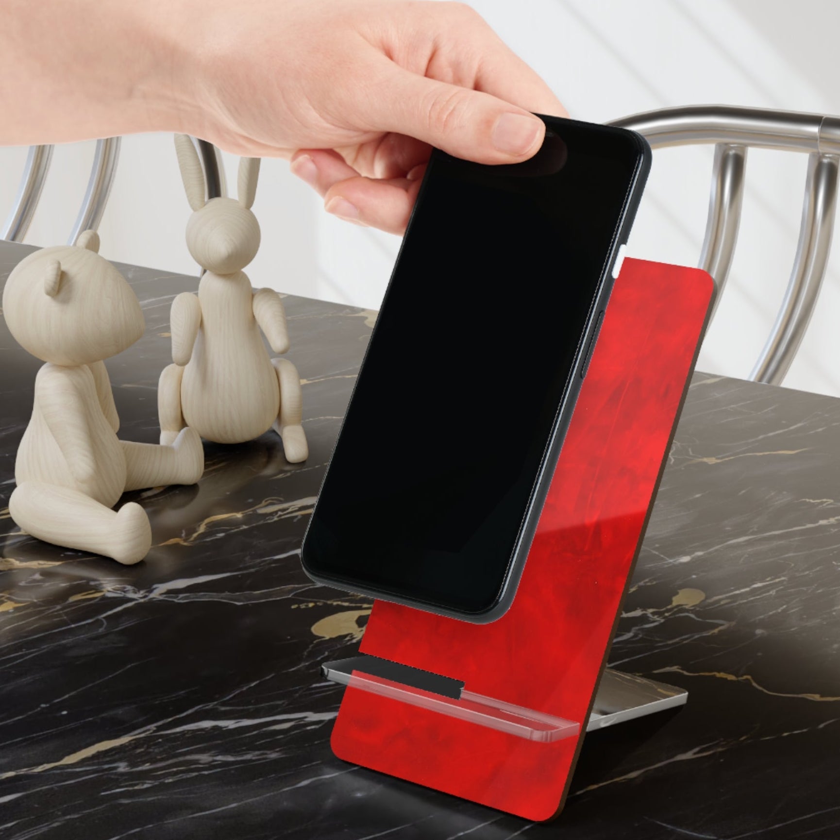 Red phone stand with a smartphone brightens up your desk