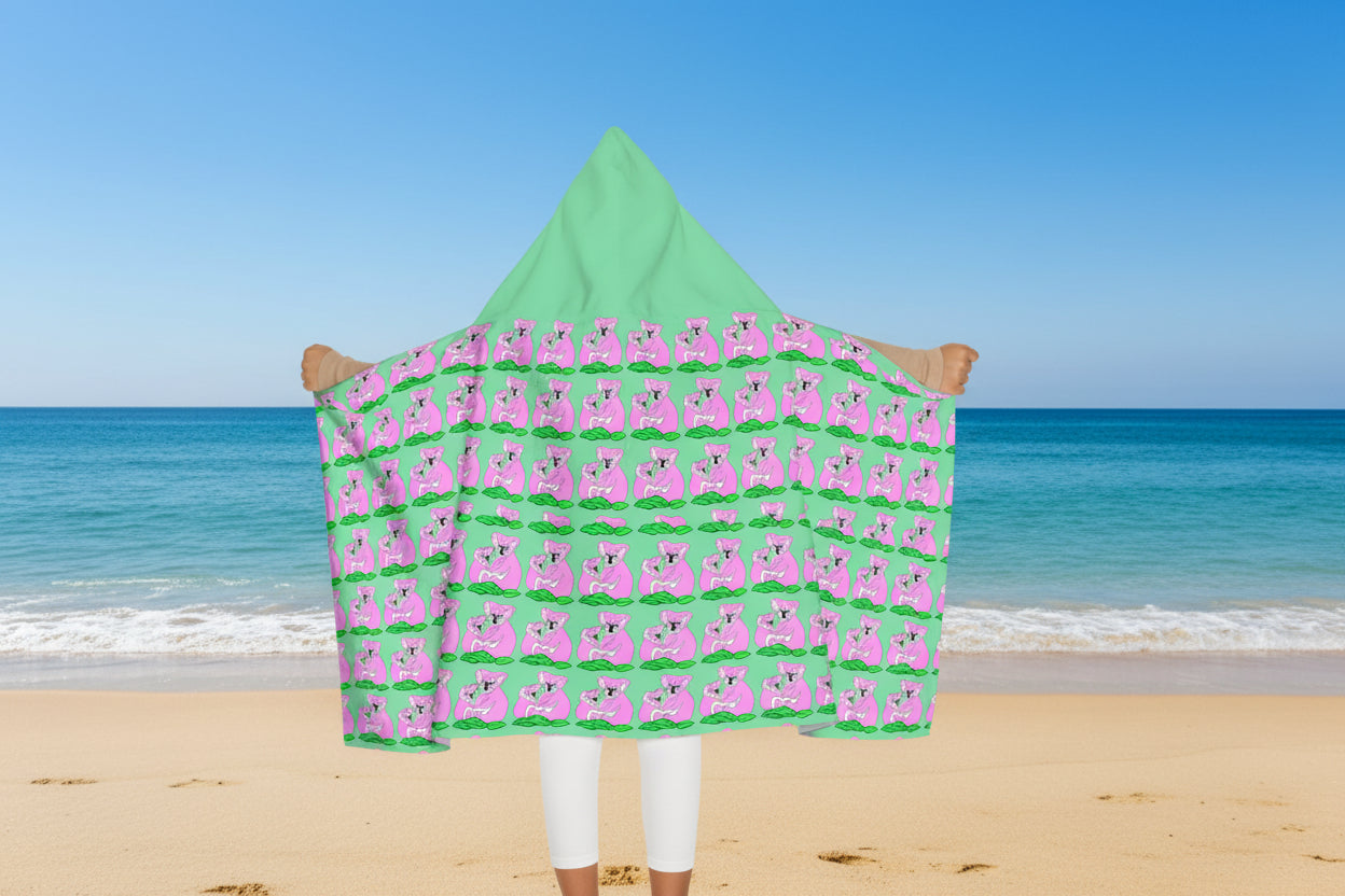 Green hooded towel with pink koala pattern opened by wearer