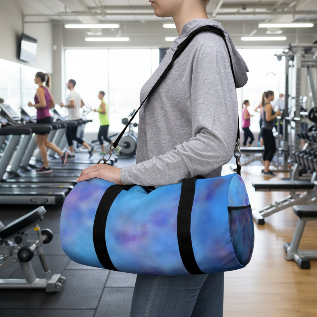 Large or small abstract blue and purple duffel bag with black straps and several compartments