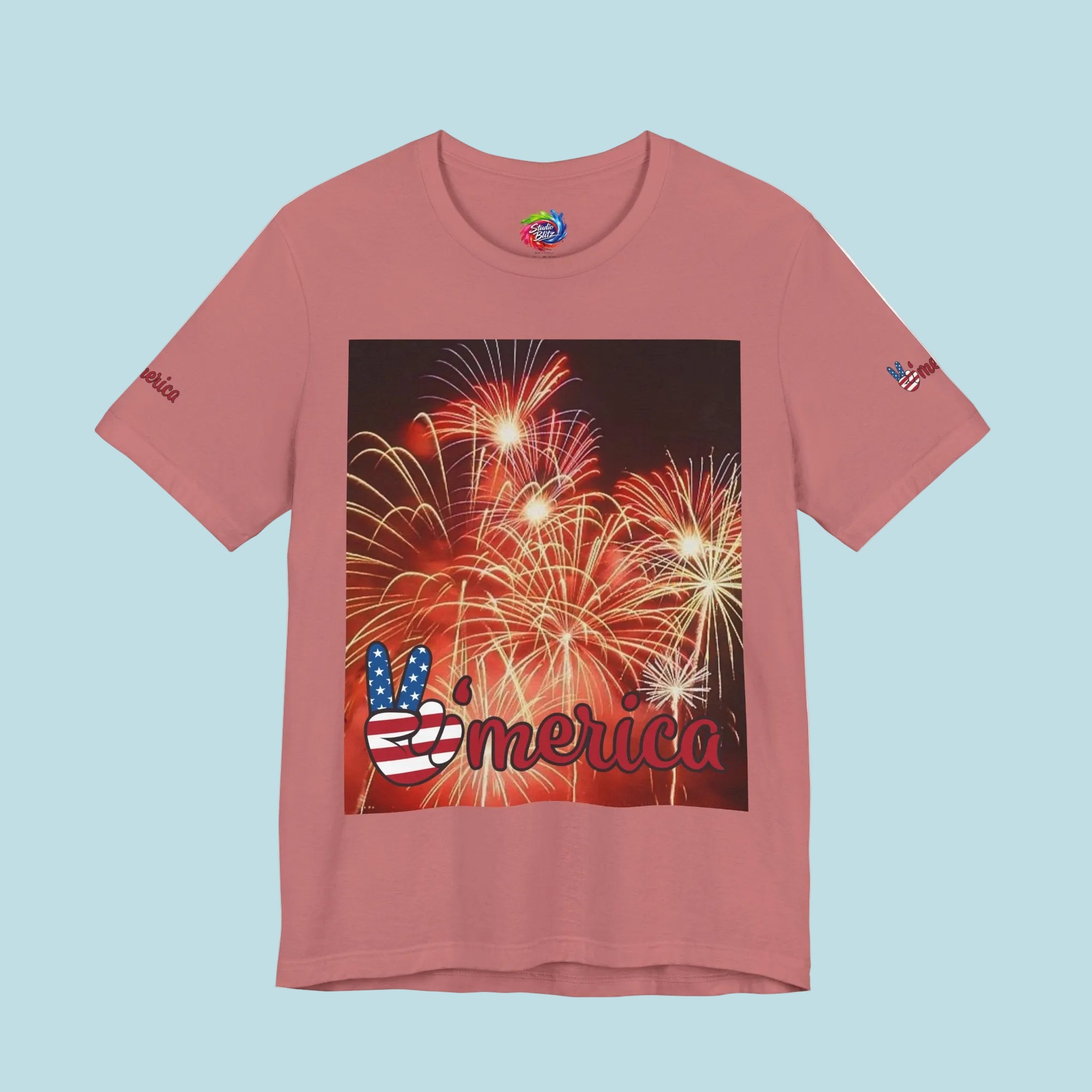 Mauve colored t-shirt with a graphic of fireworks and 'Merica' text