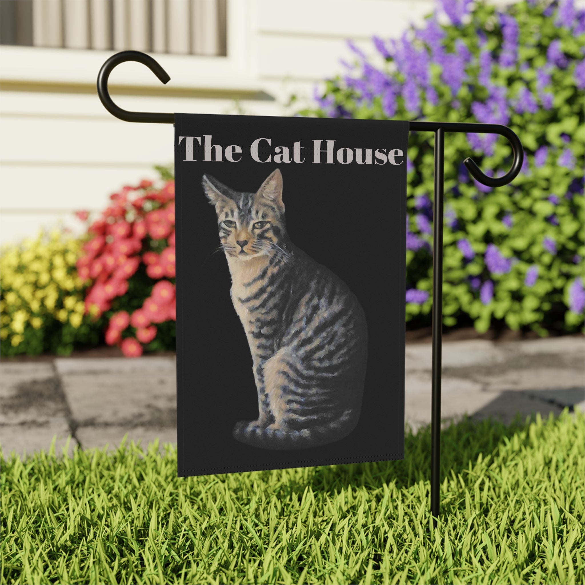 Garden flag with a painted sophisticated tabby cat and 'The Cat House' text is a great outdoors decor piece