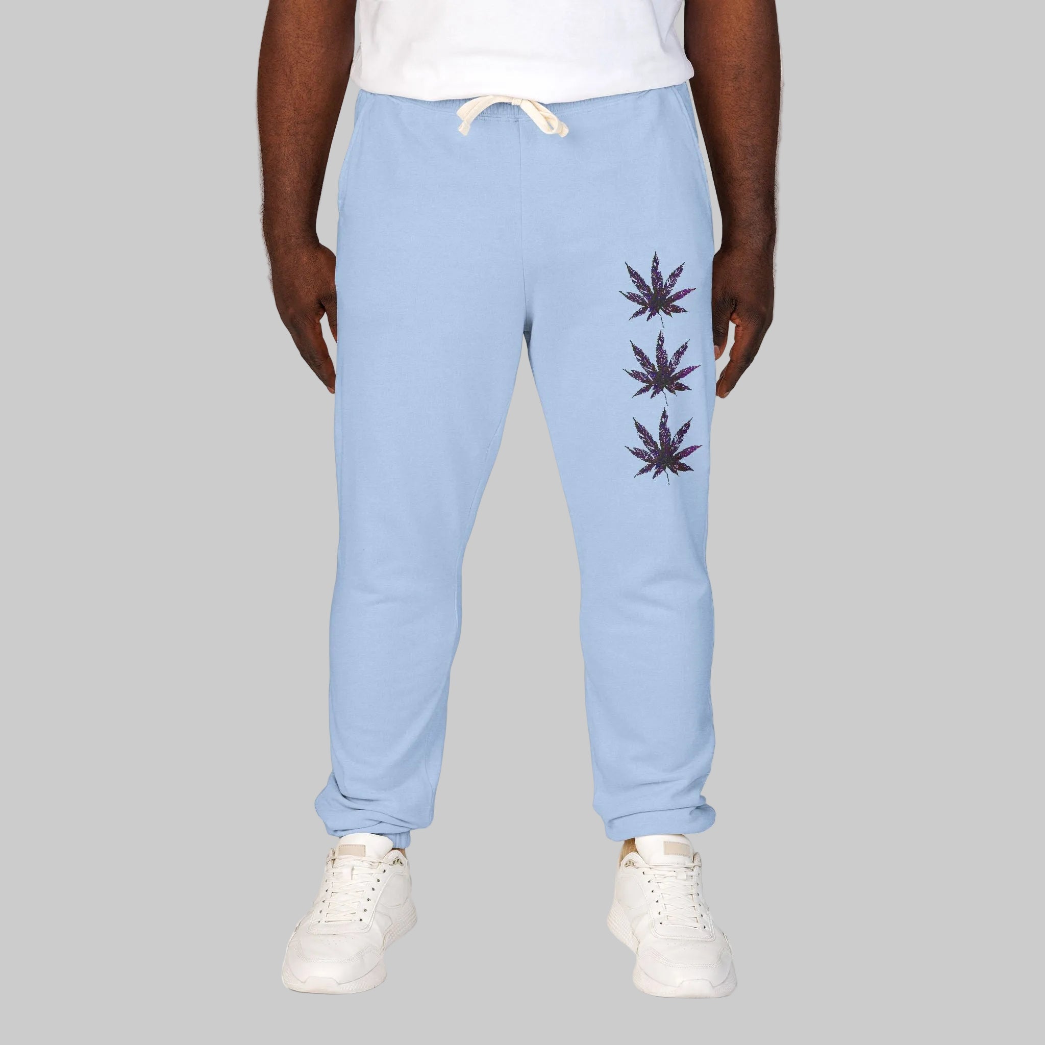 Hydrangea colored sweatpants with a vertical stack of three marijuana leaf graphics on the left leg will definitely get you noticed while feeling so good