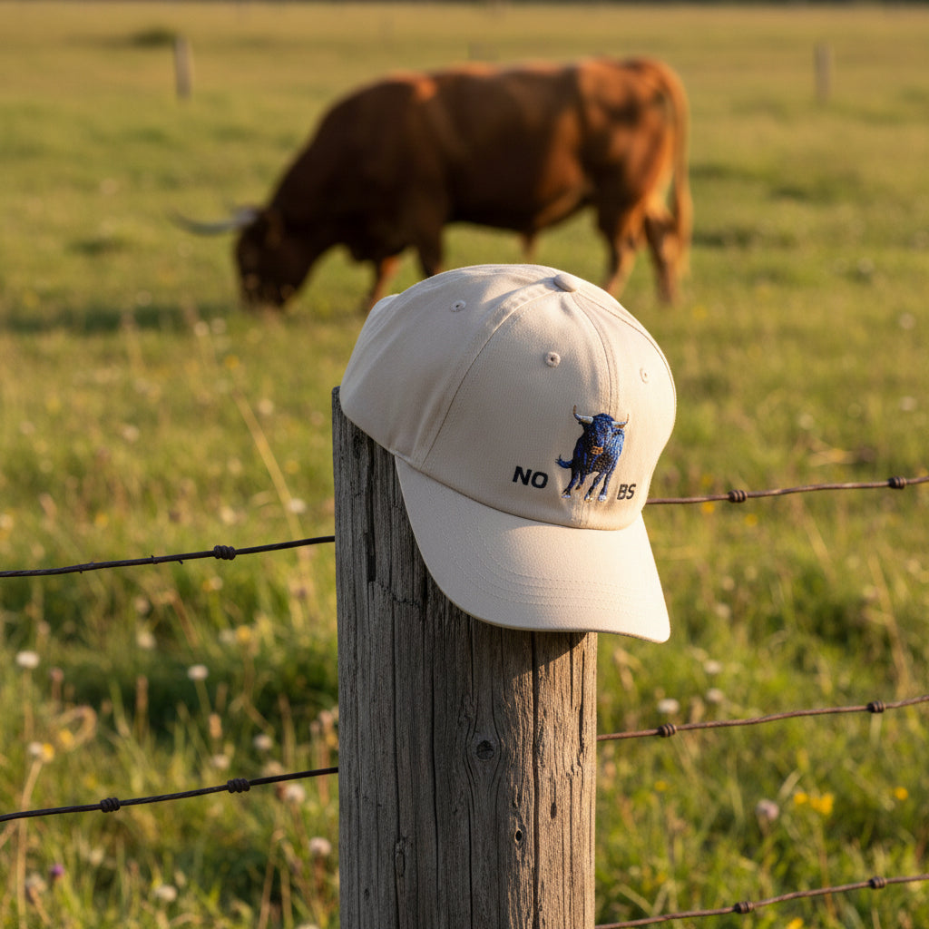 Khaki cap with blue bull graphic and 'NO BS' text on a white background