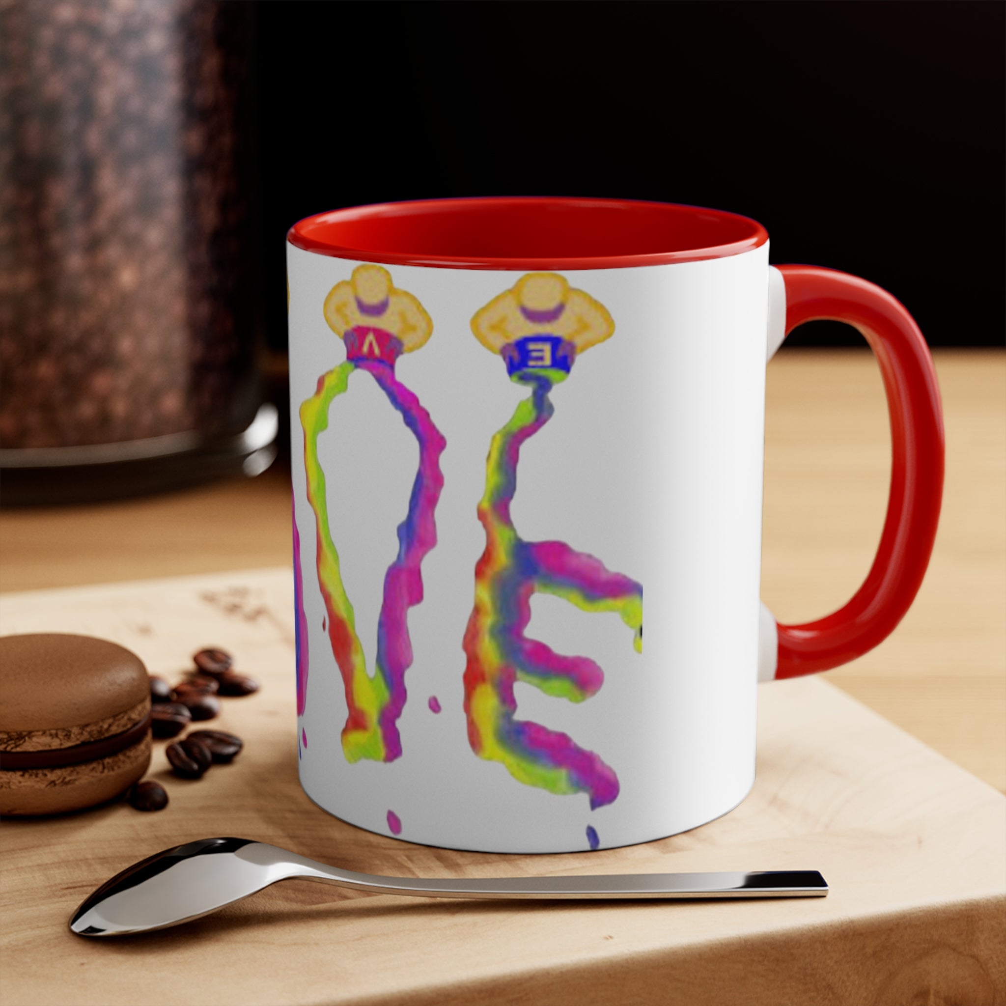 White mug with colorful love designs and red handle