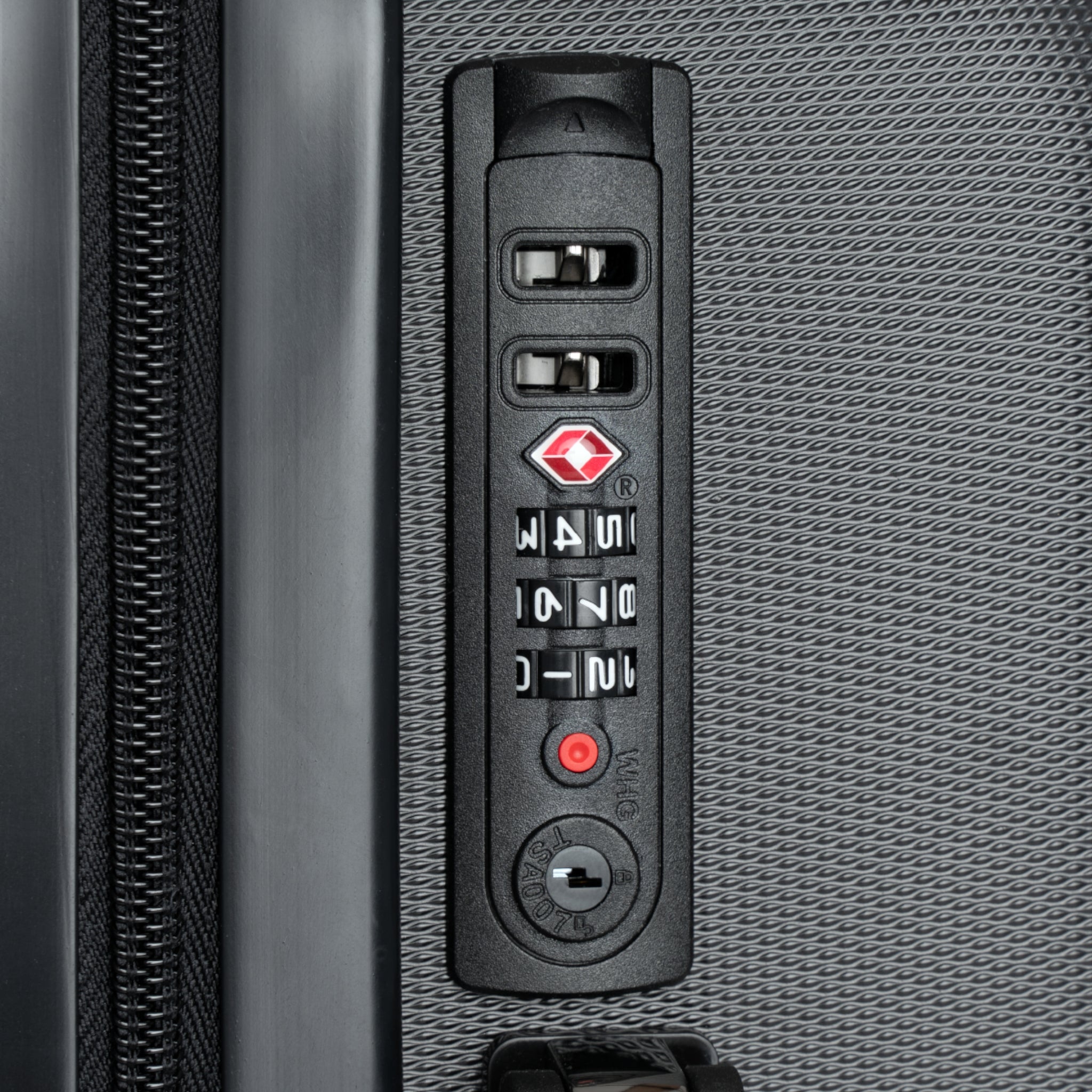 Close-up of a suitcase's combination lock mechanism.
