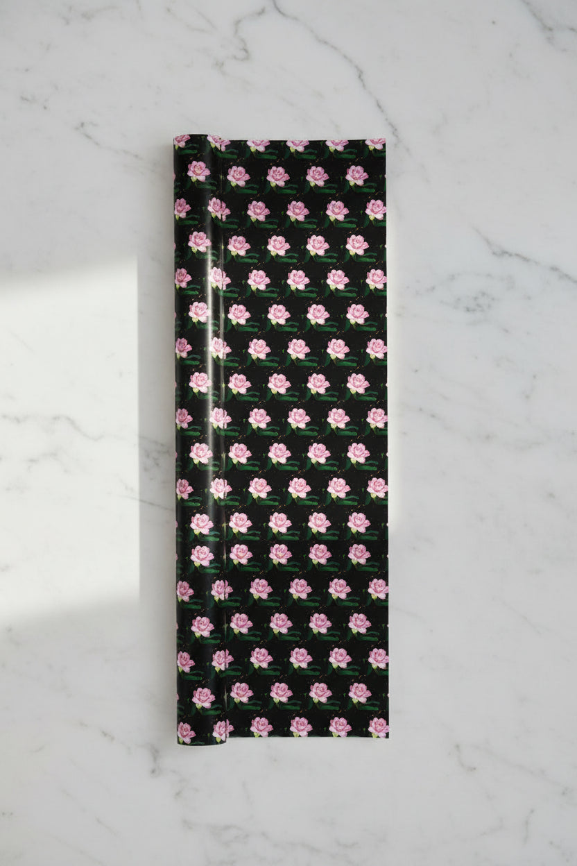 Roll of pink and black luxury wrapping paper with silky sheen and feel