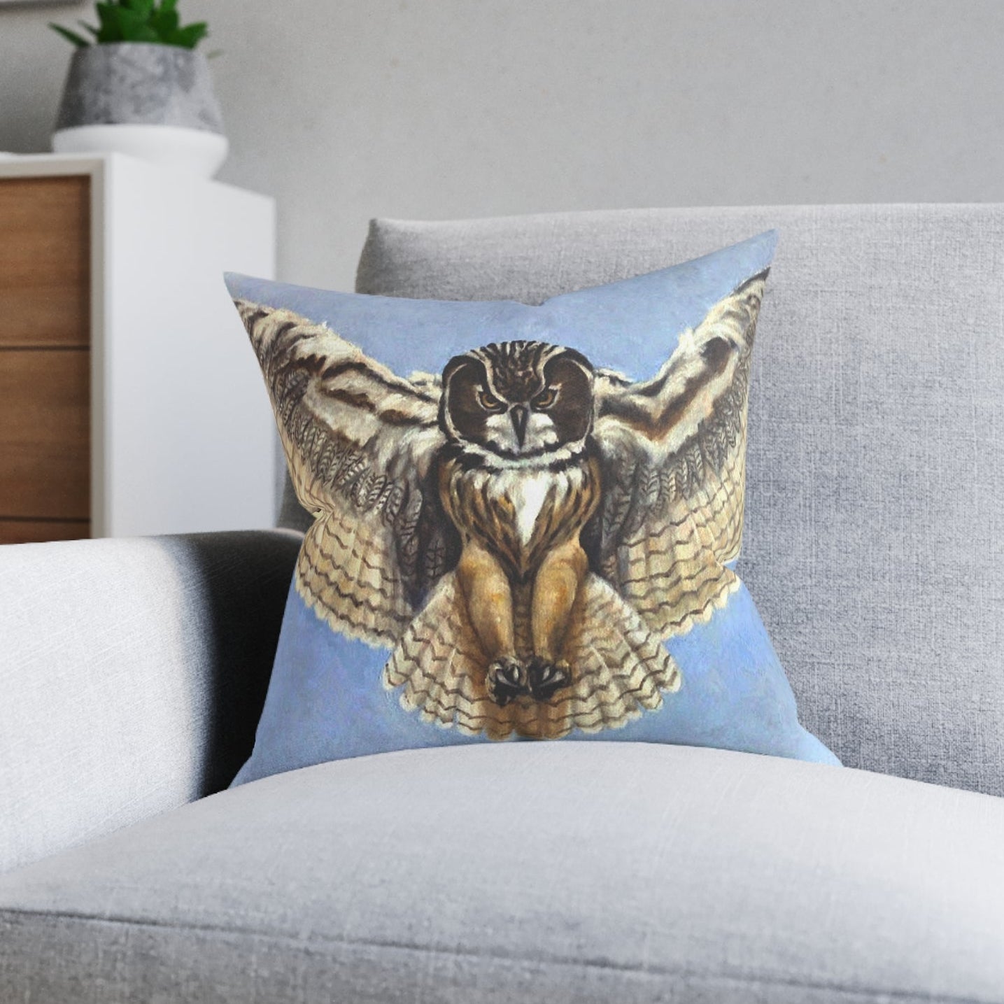 Gray sofa with a decorative pillow featuring an owl design in 3 sizes