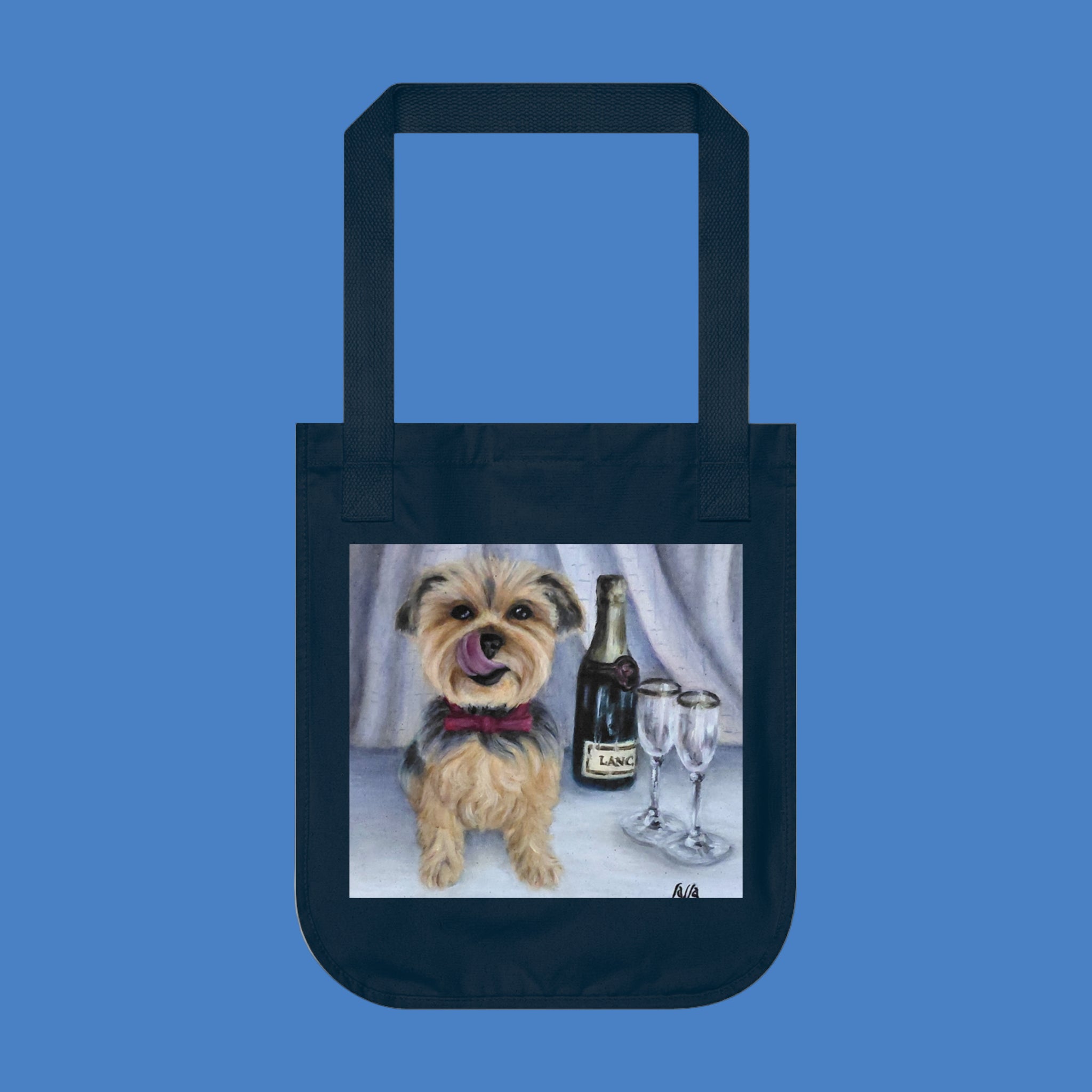 Navy tote bag with a Yorkshire Terrier and champagne ready to celebrate