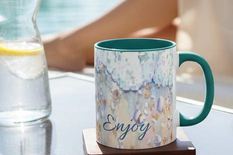 11 oz Mug with beach foam and shells pattern and 'Enjoy' and 'Relax' text with teal accents