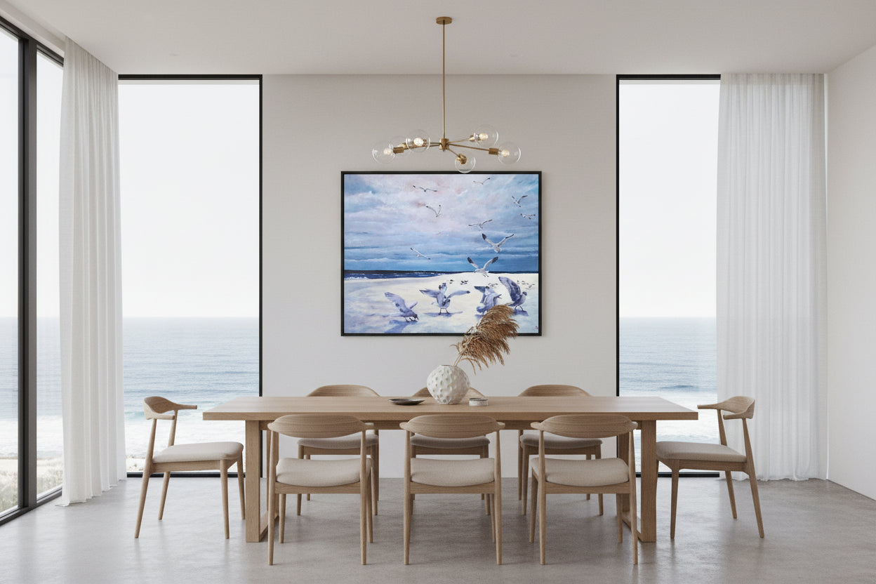 Painting of seagulls on a beach with a blue/pink sky and ocean.