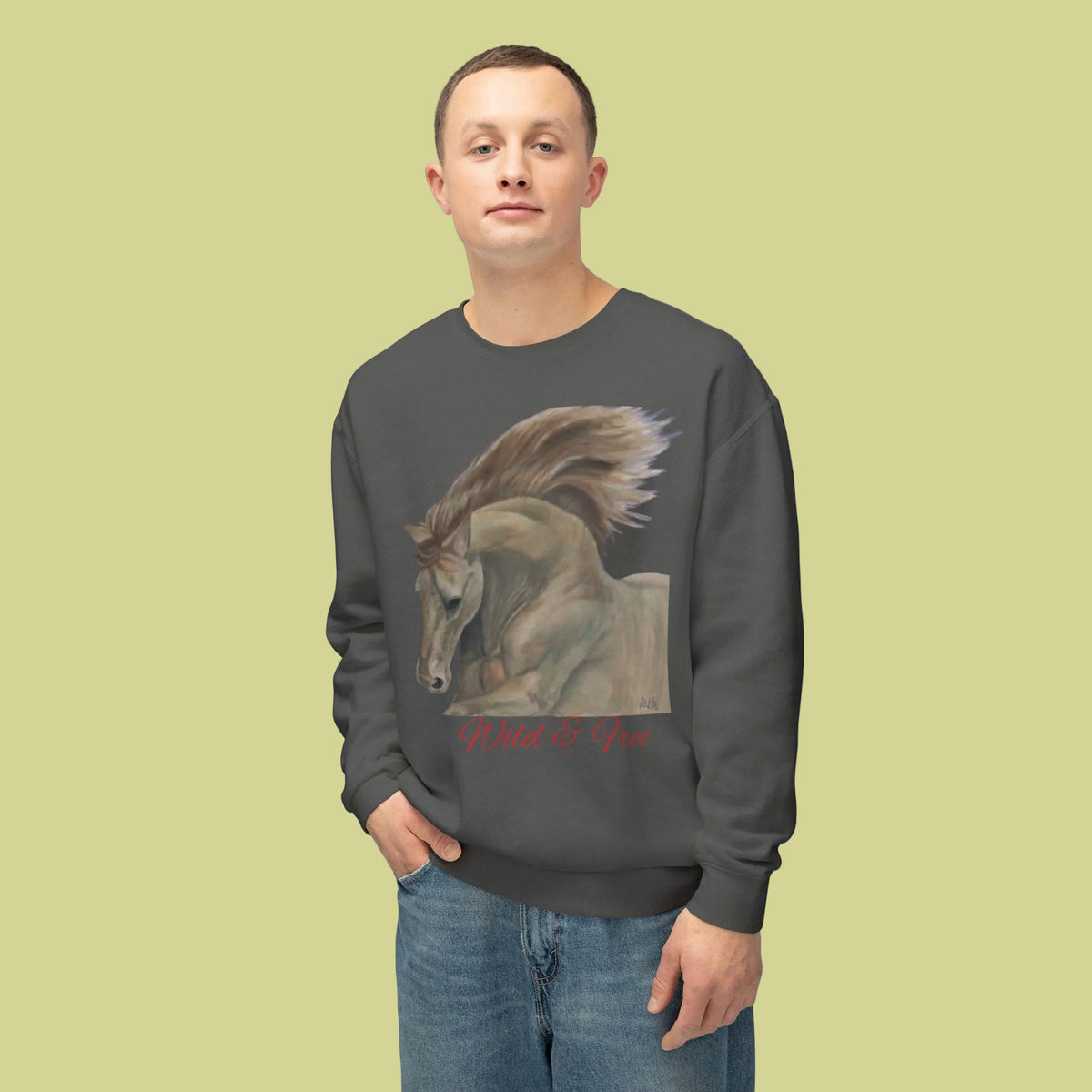 Pepper colored crewneck sweatshirt with a graphic print of a horse's and with red cursive text reading 'Wild & Free' below it for men and women