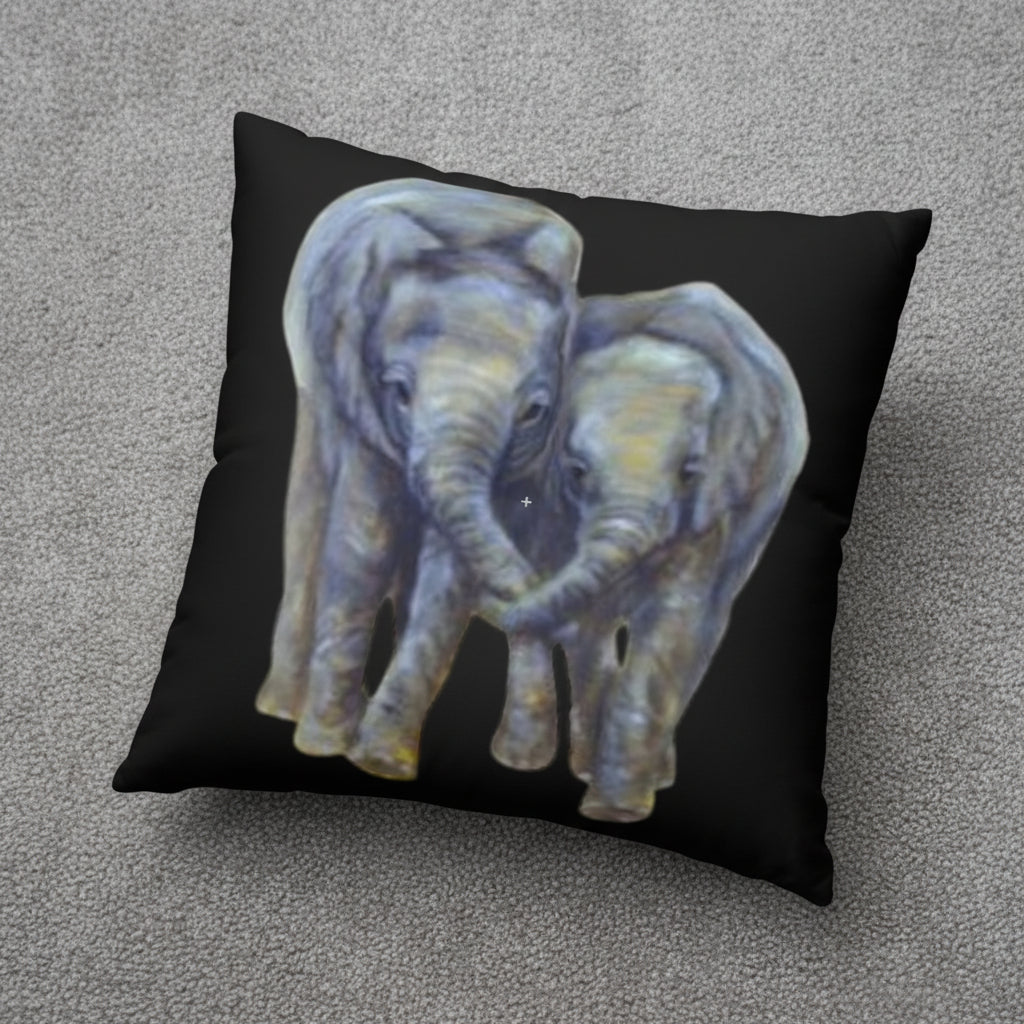 Decorative accent floor pillow with two painted elephants on a black background