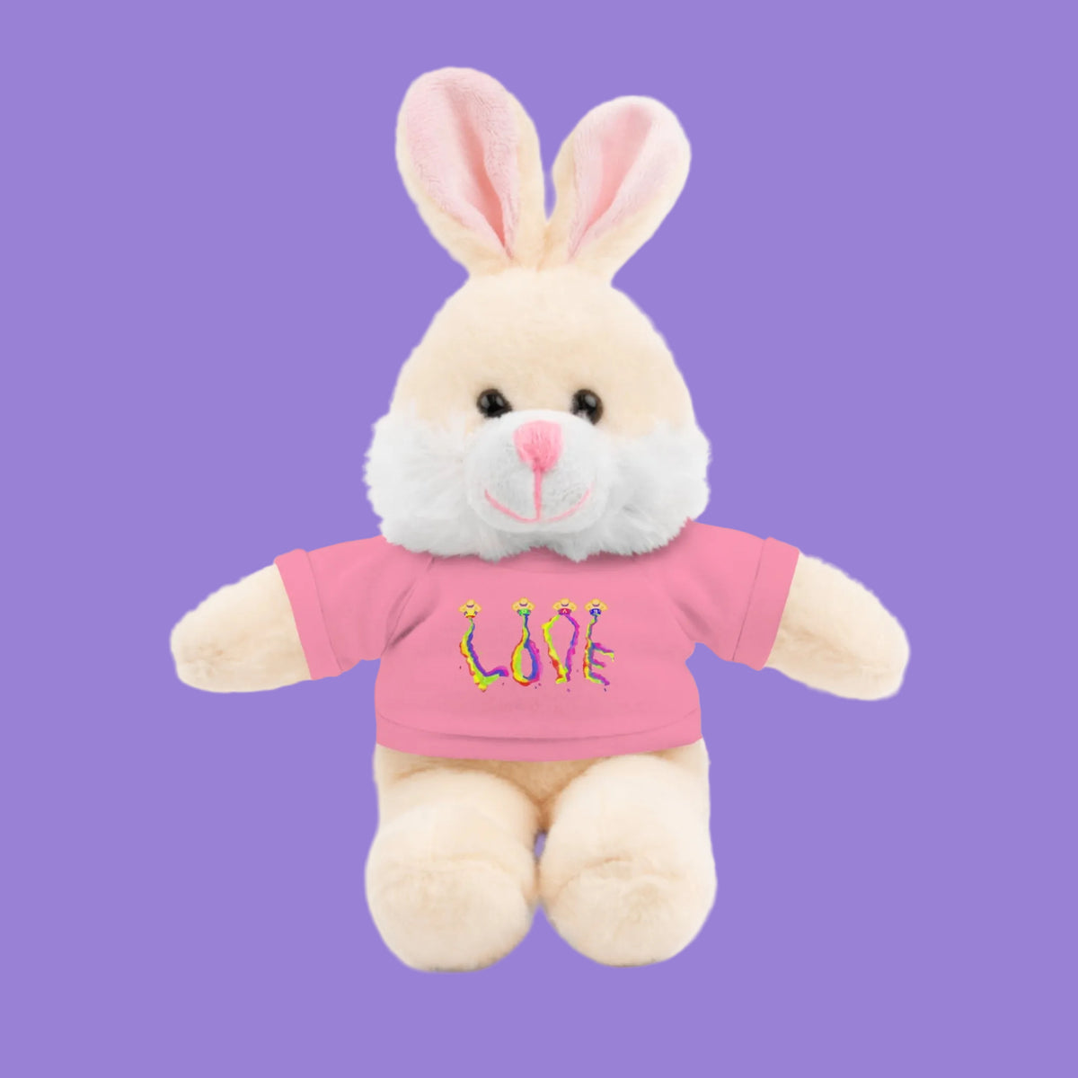 A plush bunny toy with cream-colored fur, pink inner ears, and a pink shirt that reads LOVE in colorful text
