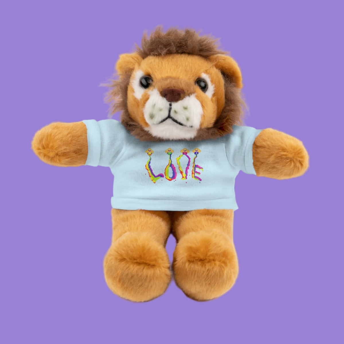 Plush lion toy wearing a light blue t-shirt with a Love graphic