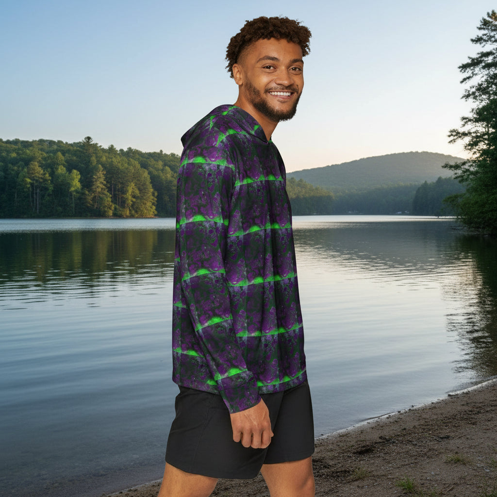 Man wearing a patterned shirt and black shorts on a walk by a lake background