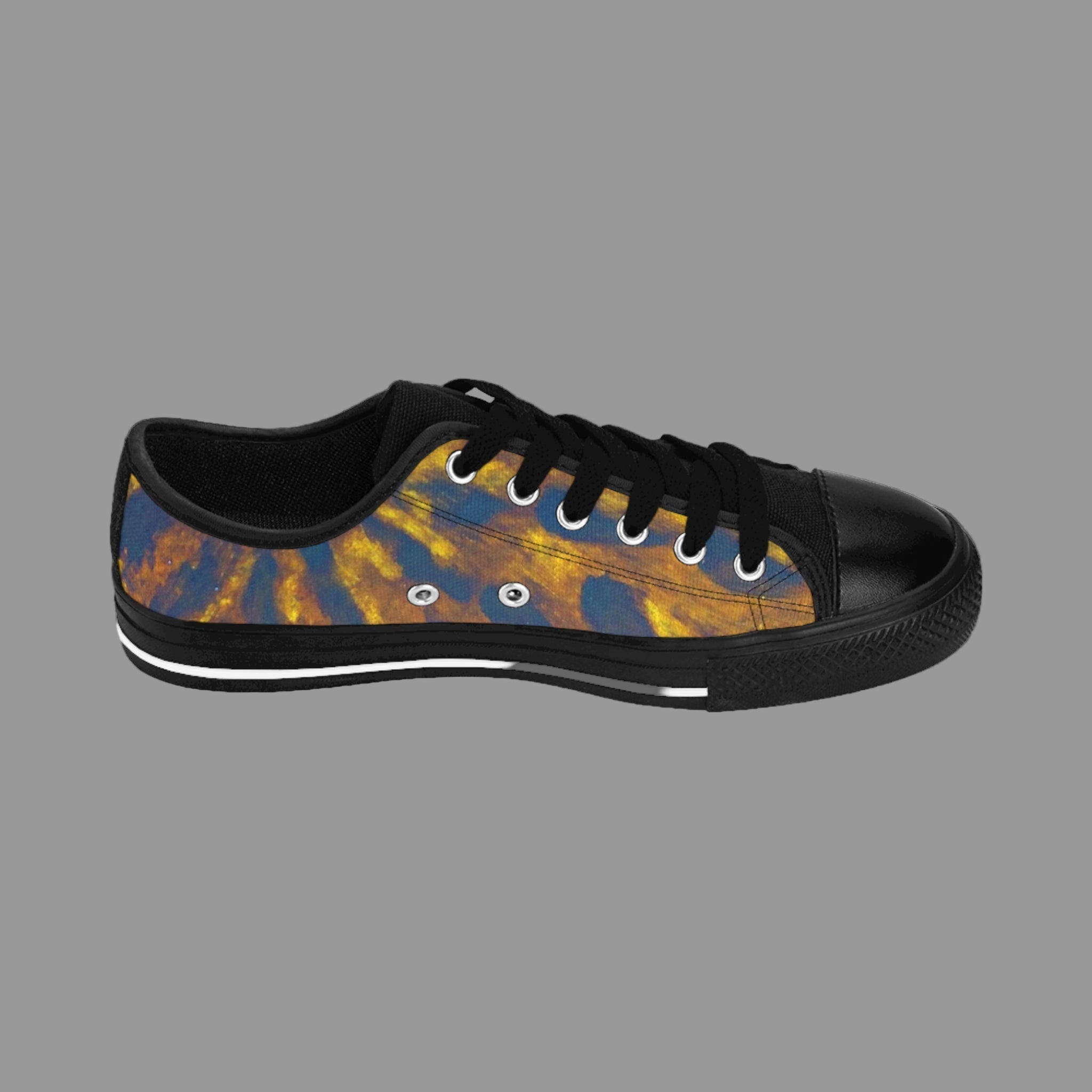 Black sneaker with tie-dye pattern on a light background