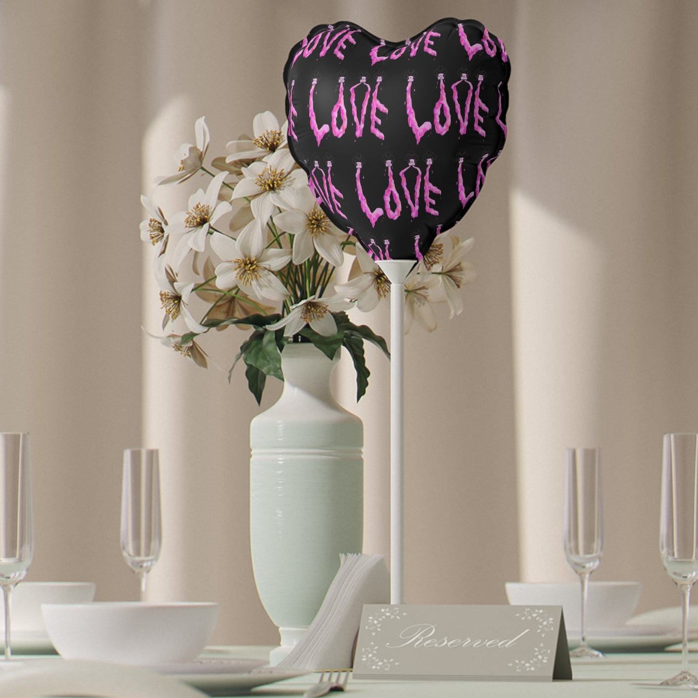 Decorative heart-shaped foil balloon with 'LOVE' text