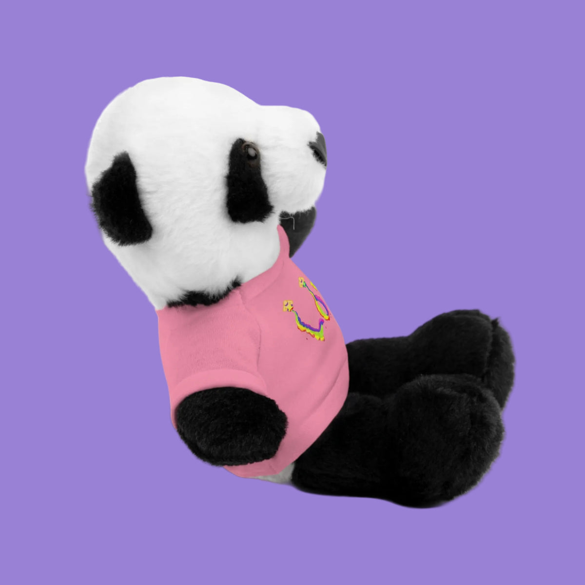 Plush panda toy wearing a pink tee shirt in side view