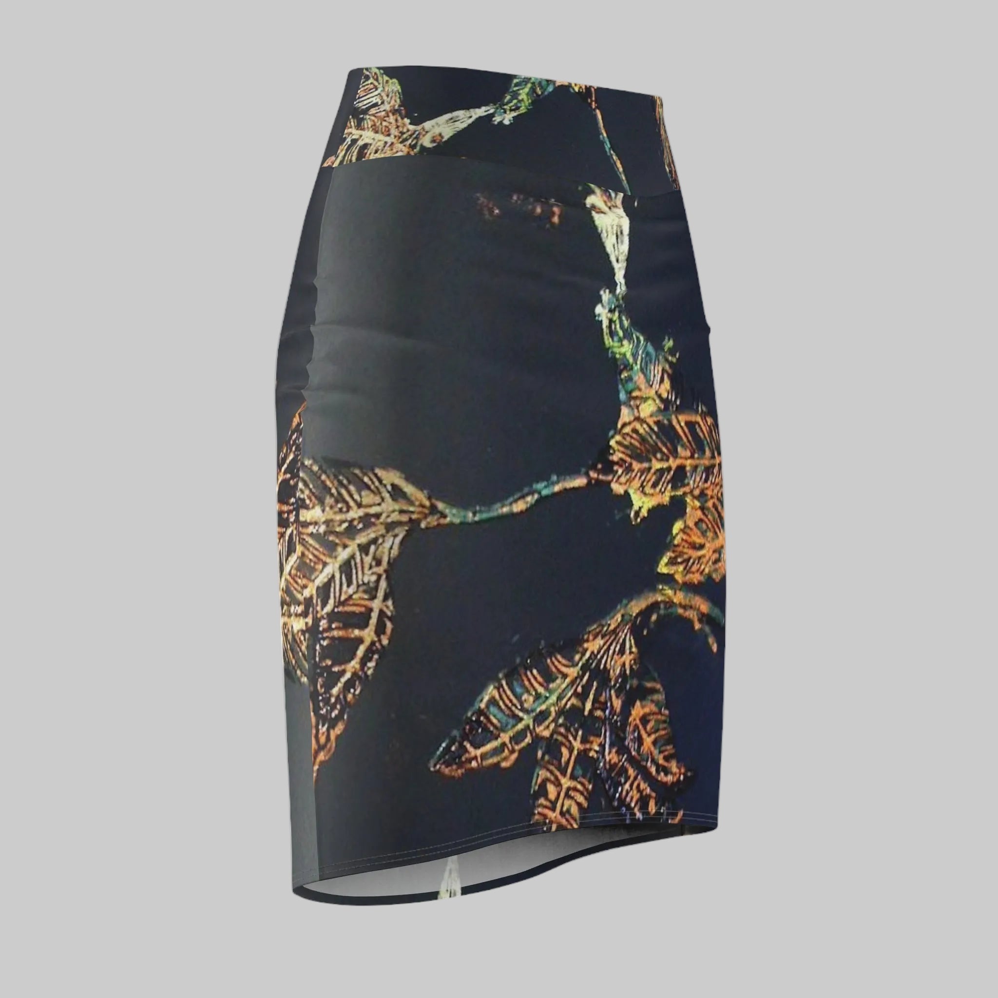 Stylish Pencil skirt featuring a vibrant, multicolored tropical leaf pattern in orange, gold, and green will wow. 95% Polyester- 5% Spandex