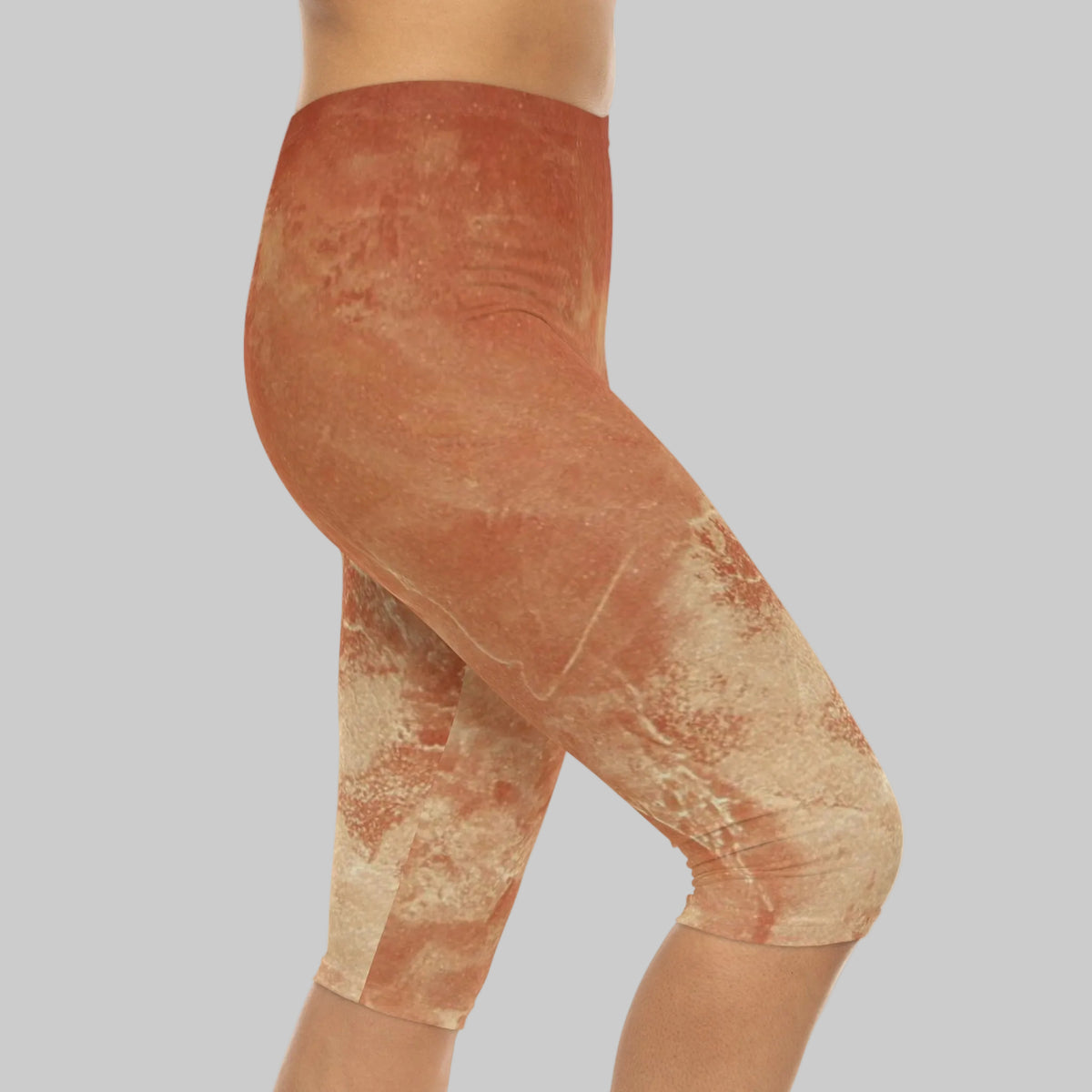 High-waisted capri leggings with a mottled terracotta and beige abstract print 95% polyester 5% spandex