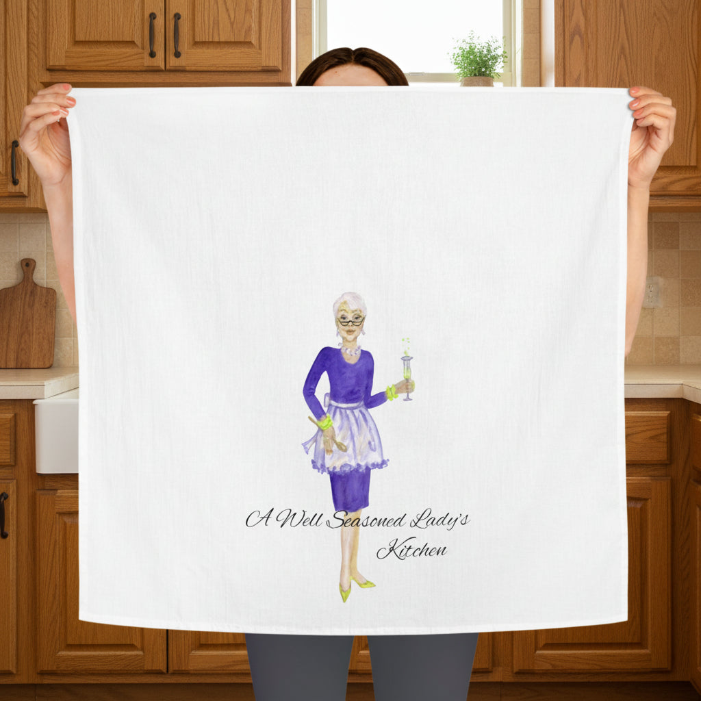 Large Cotton Tea Towel with illustration of an aproned lady and text 'A Well Seasoned Lady's Kitchen'