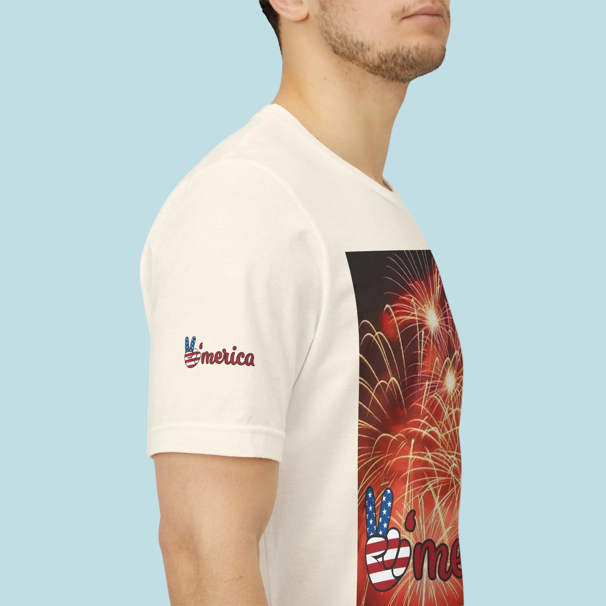 Natural color t-shirt with a colorful graphic design on the sleeve and front, back