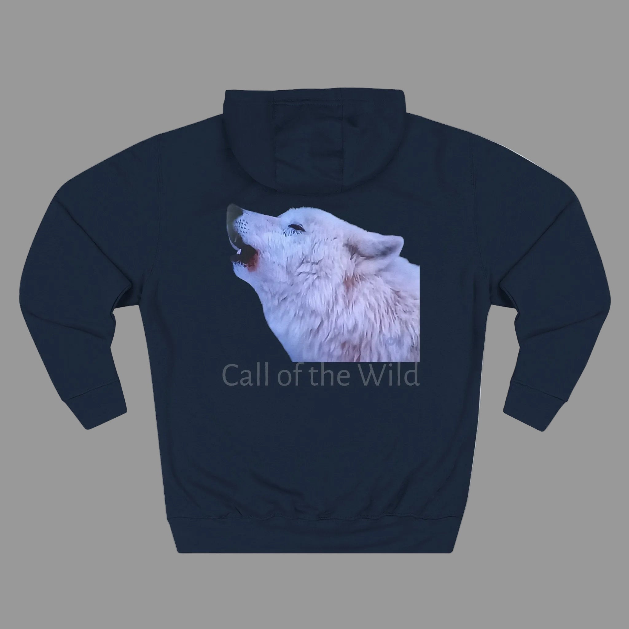 A navy blue pullover hoodie with a graphic print of a howling white wolf on the chest and the text 'Call of the Wild' underneath