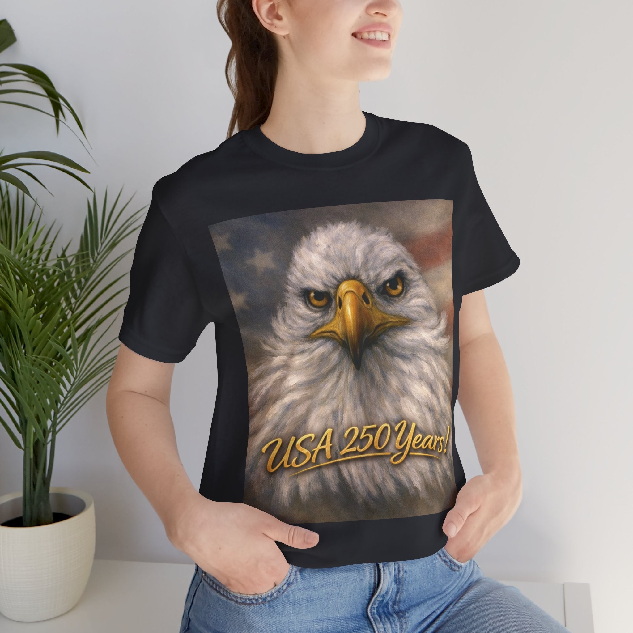 Person wearing a black t-shirt with an eagle graphic and 'USA 250 Years!' text.