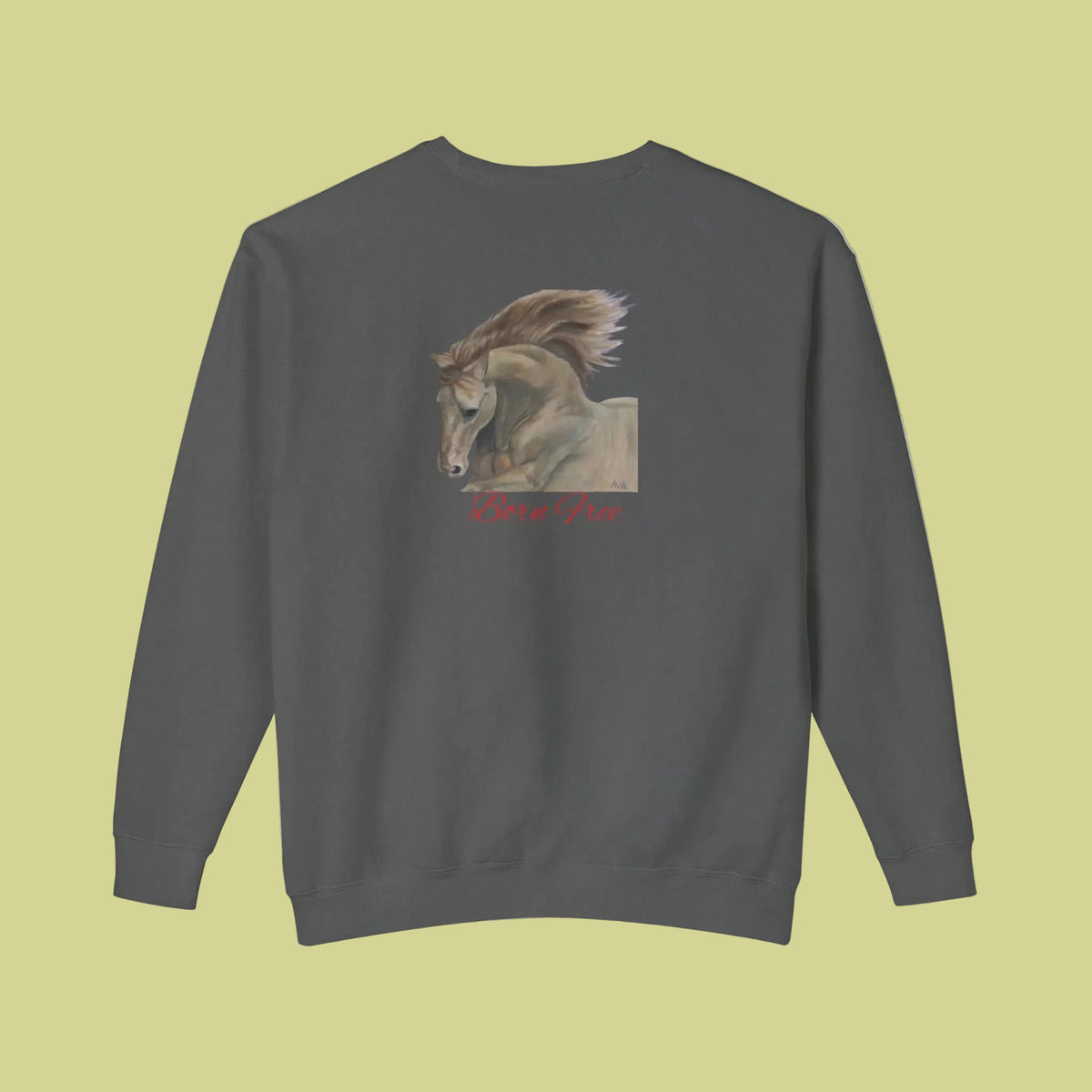 Unisex Pepper colored crewneck sweatshirt featuring a graphic print of a horse with its mane flowing, and the text 'Born Free' in red script underneath