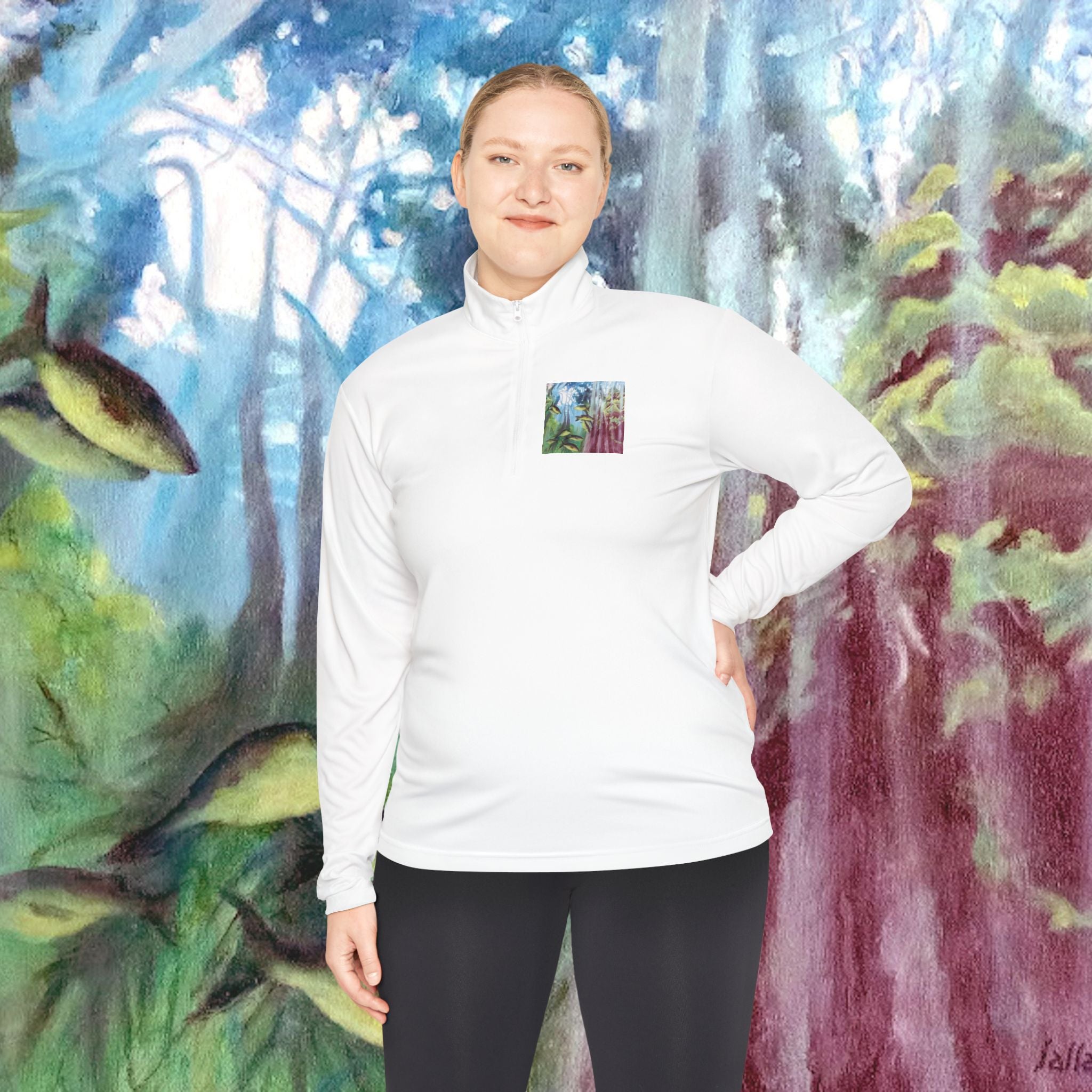 Person wearing a white long-sleeve shirt with a small graphic on a colorful nature-themed background