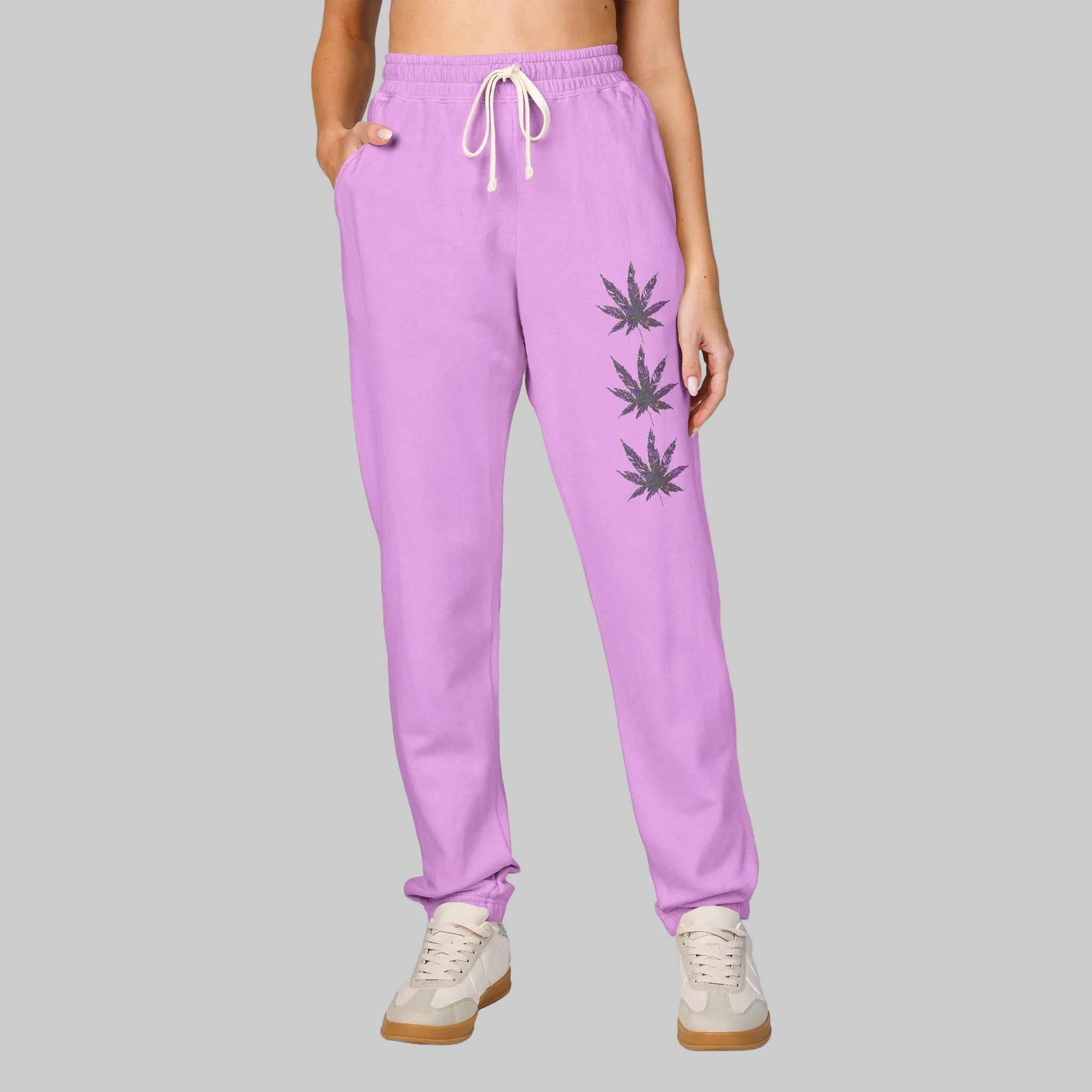 Neon Violet sweatpants for women or men in soft, durable cotton to hang out in all day with cannabis leaf graphics