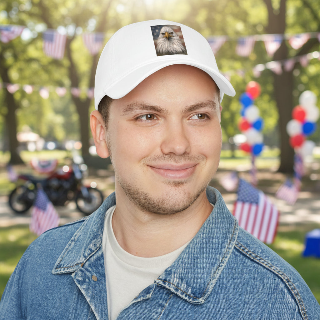 Man wearing a white cap with a logo and text, smiling on a plain background