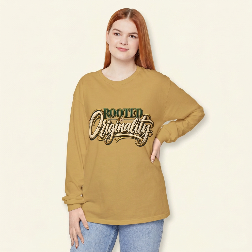 Red-haired woman wearing a mustard gold Rooted in Originality long-sleeve tee, hand on hip.
