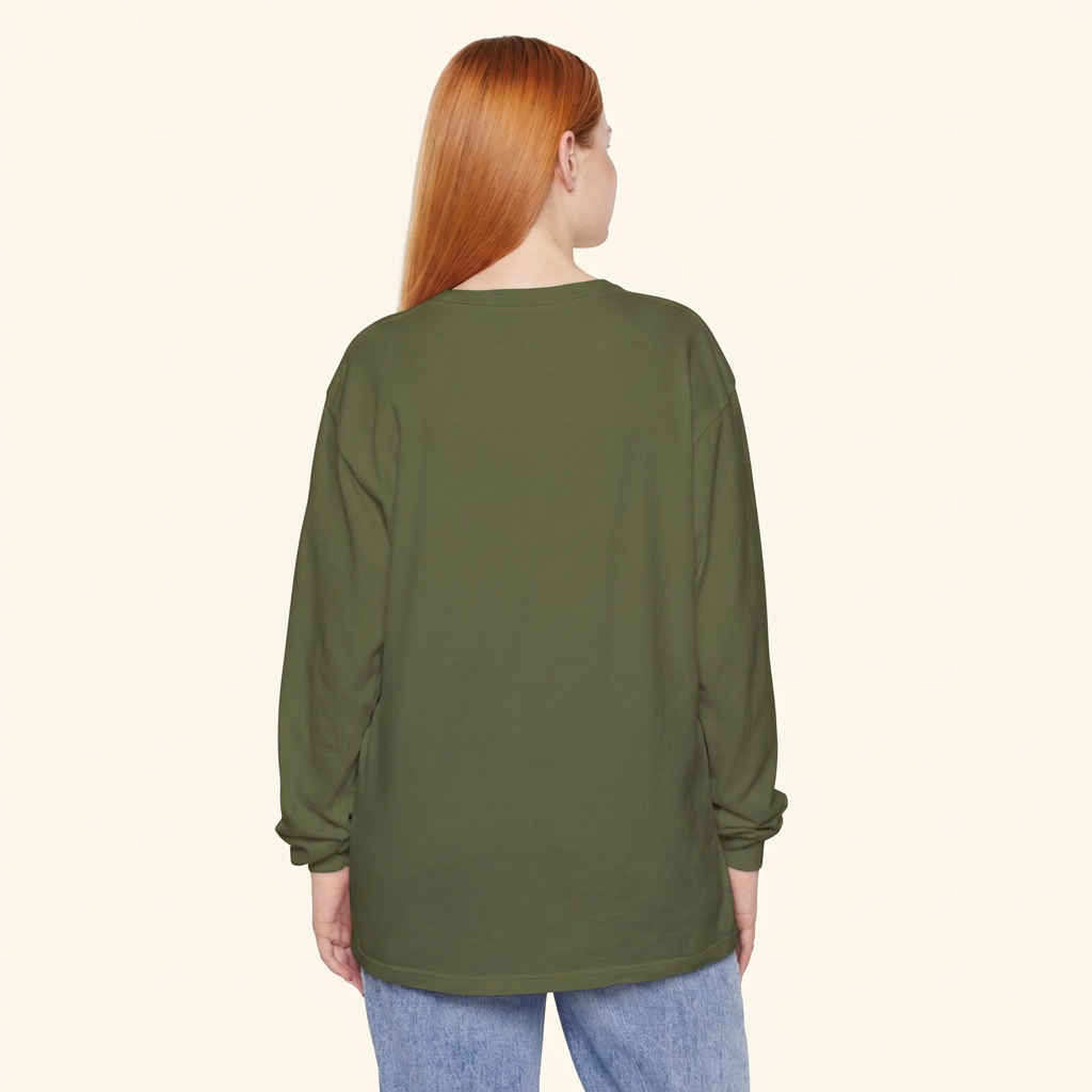 Back view of a red-haired woman wearing a plain olive green long-sleeve tee and blue jeans.