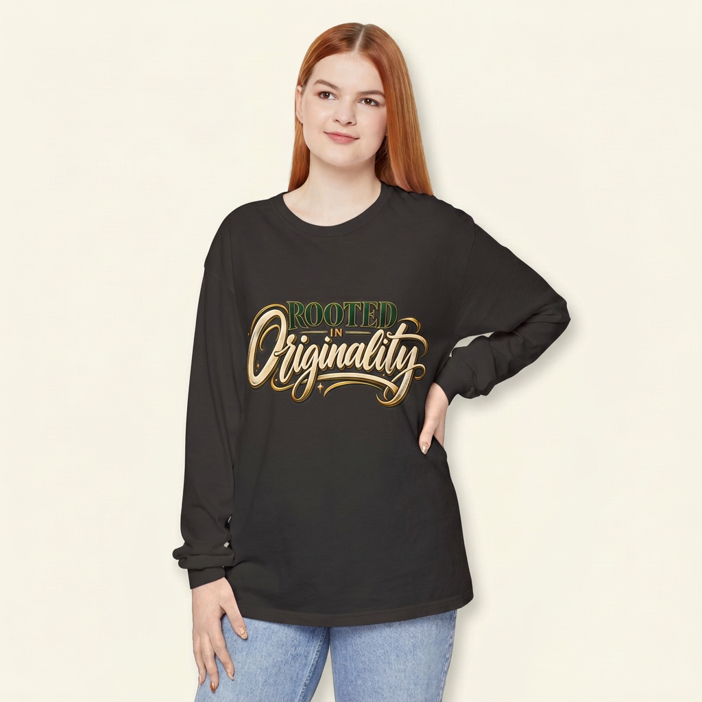 Red-haired woman wearing a charcoal Rooted in Originality long-sleeve tee, hand on hip.
