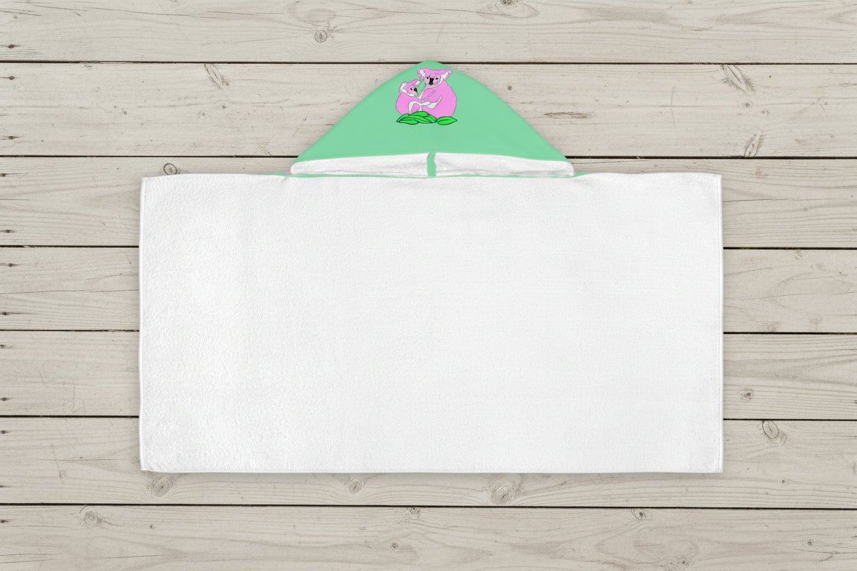 Hooded towel with green hood featuring a cartoon character show white cotton terry towel inside
