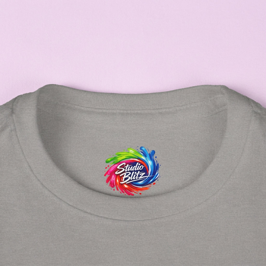Close-up of kid's gray crewneck t-shirt featuring a colorful circular 'Studio Blitz' logo printed on the inside collar